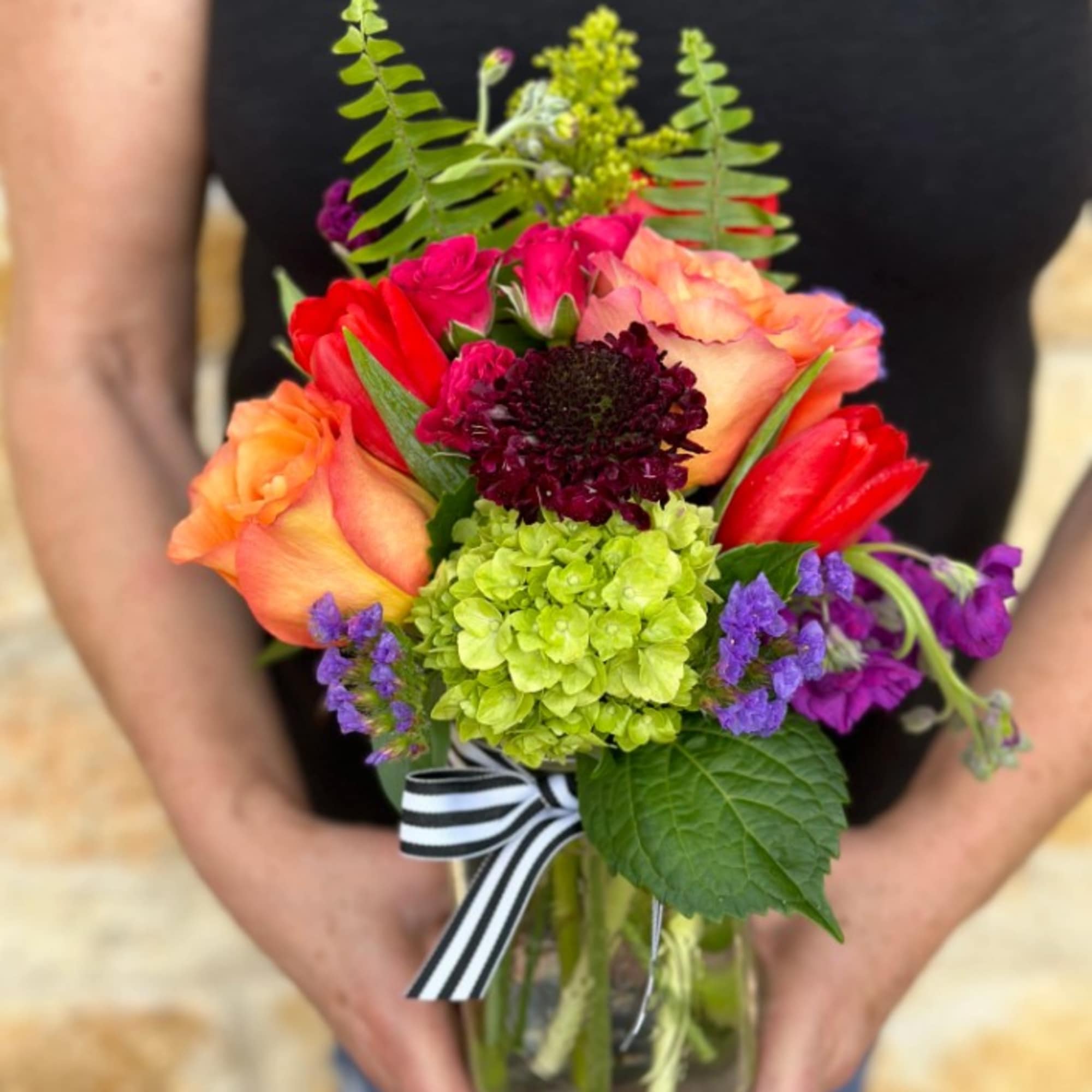 A bright, colorful, garden mix with season's prettiest blossoms. Arranged in our, photo 2 of 3