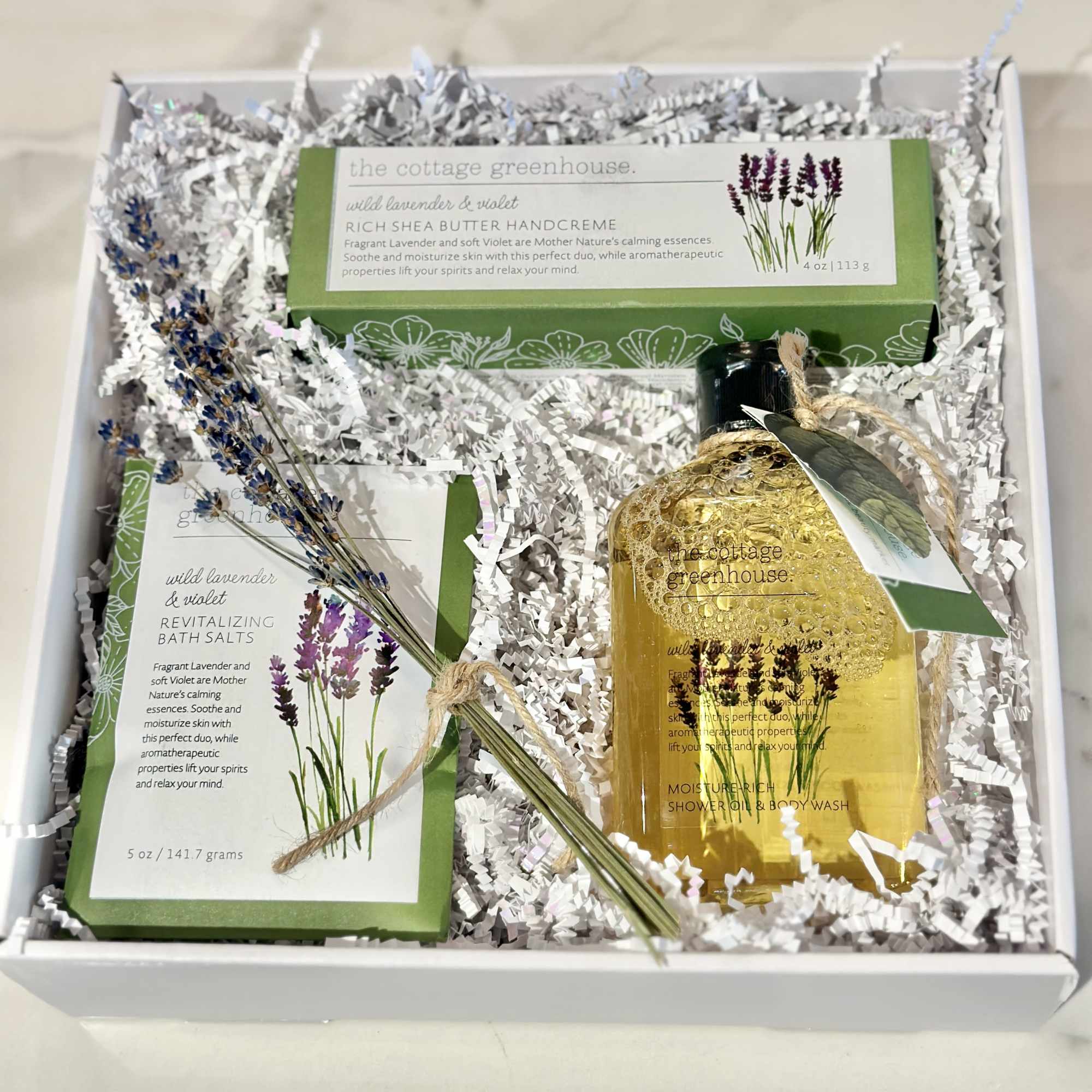 Gift box with lavender bath products and a small dried lavender bundle