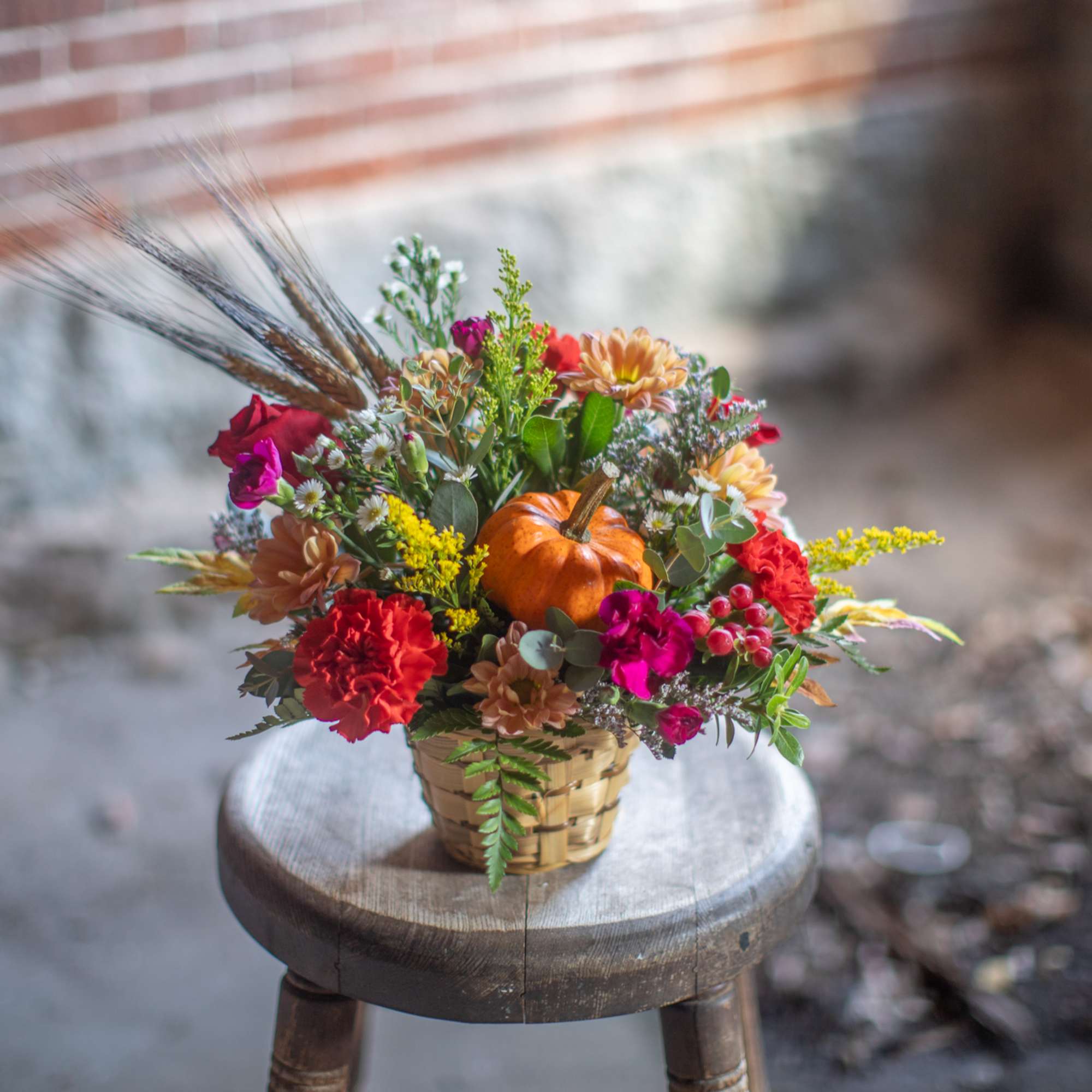 A mini pumpkin gourd pick is the focal point of the arrangement., photo 3 of 3