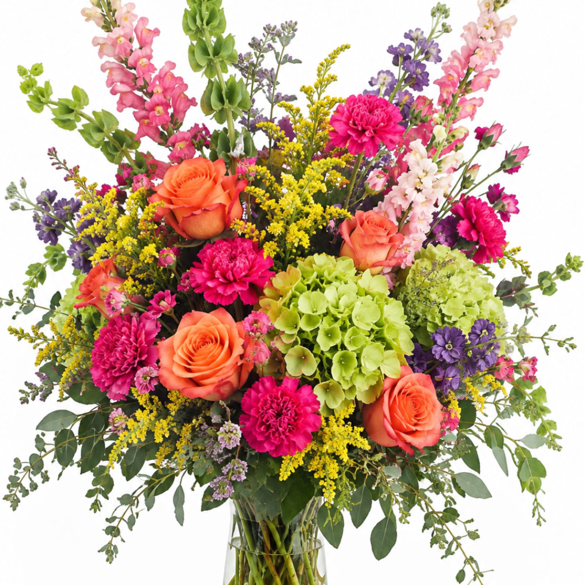 Bright mixed bouquet in a clear glass vase with roses, hydrangea, and tall blooms