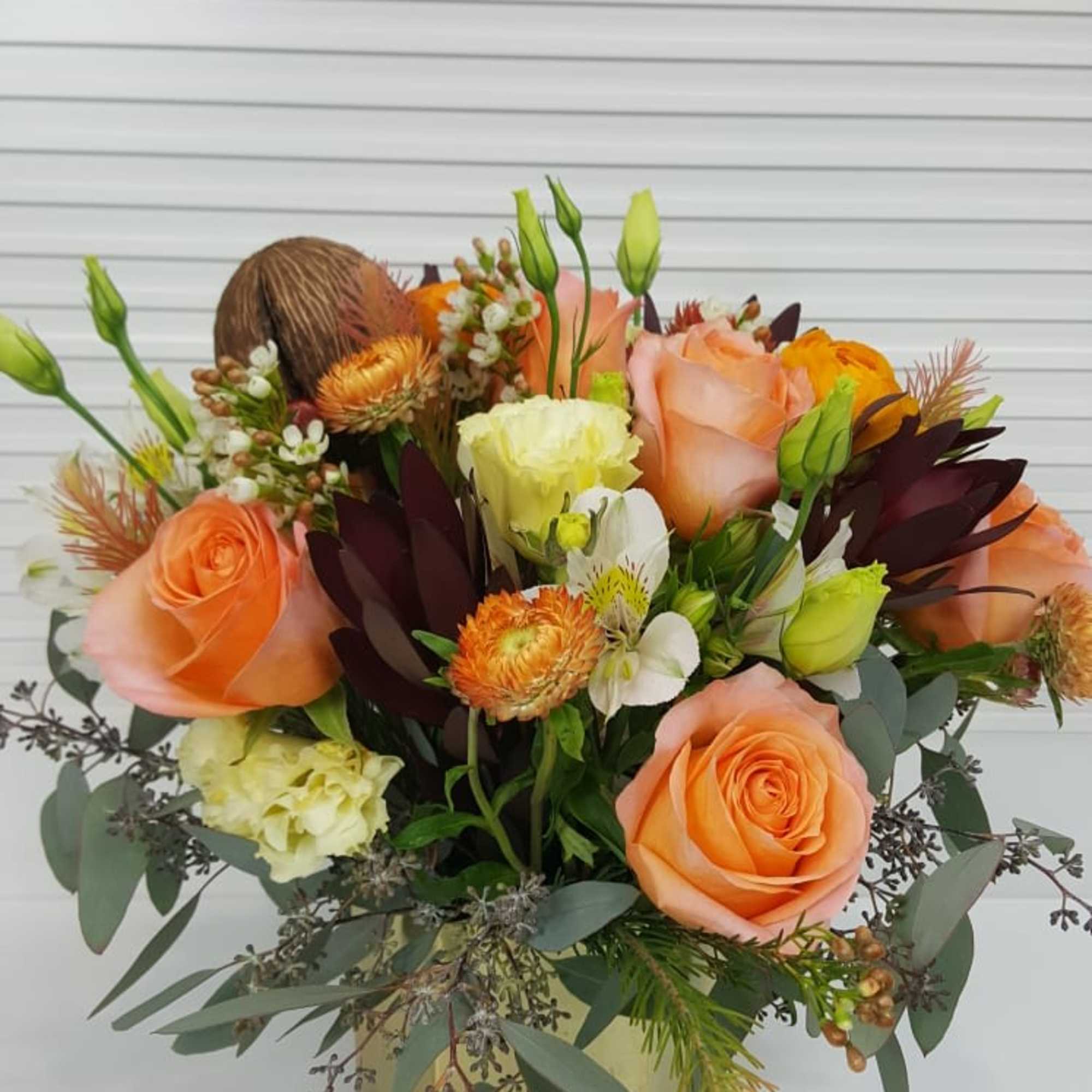 Collection of peach colored roses, ranunculus, alstroemeria, Lisianthus, wax flowers, and more, photo 3 of 3