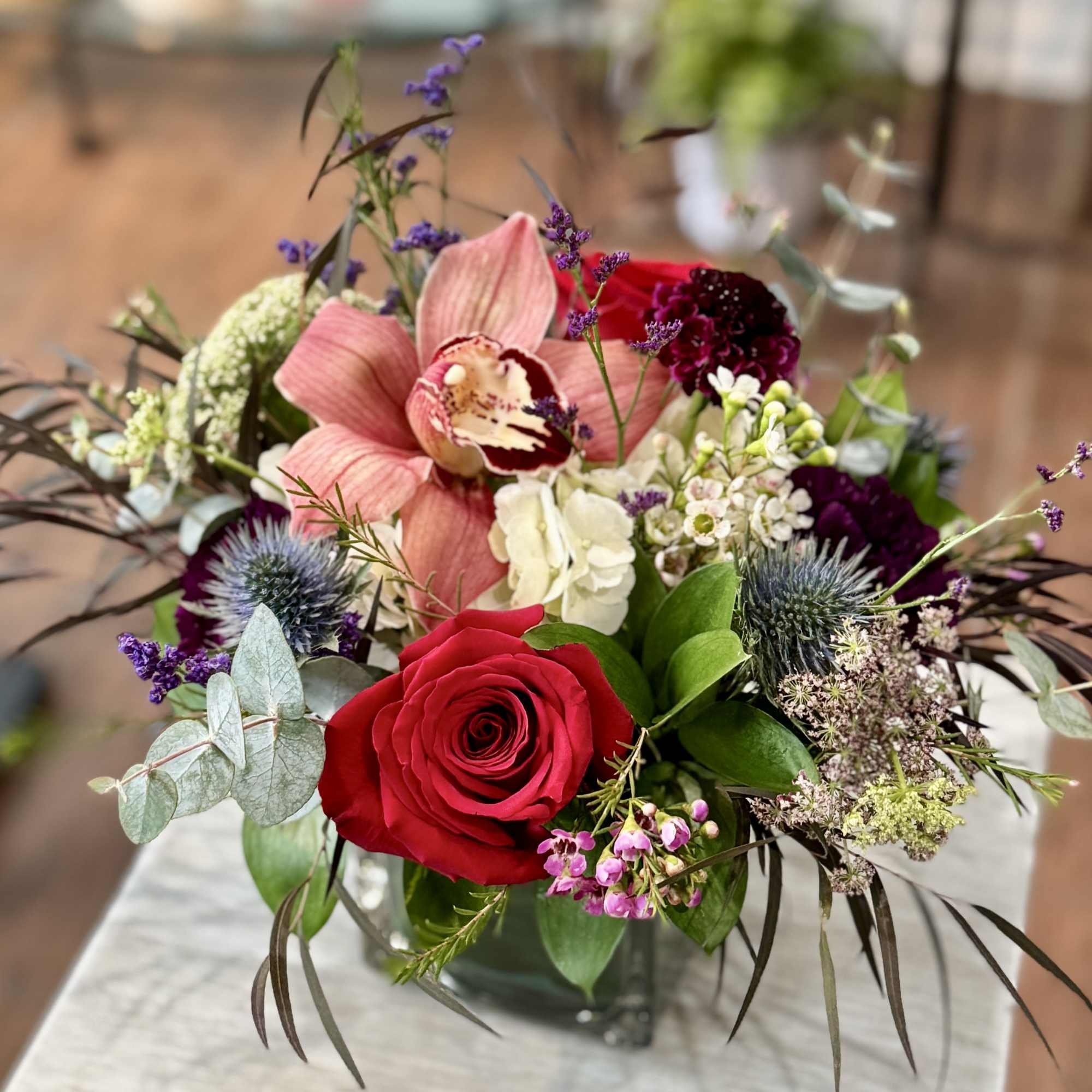 Bouquet of red and pink flowers in a glass vase