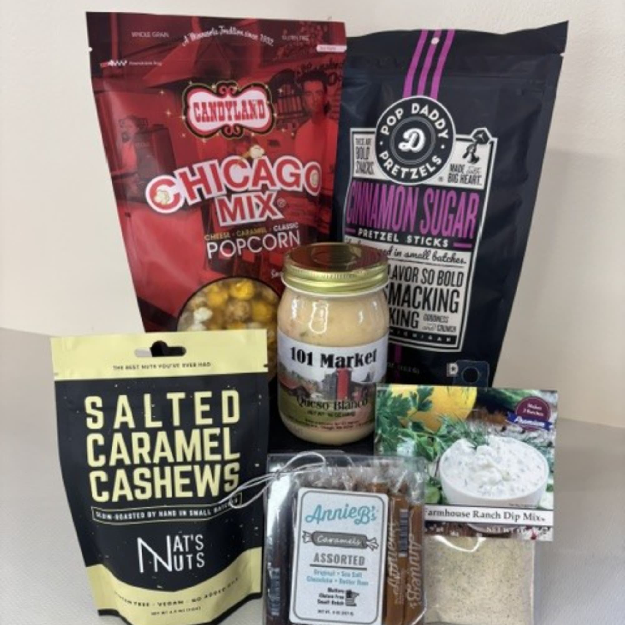 Assorted snack gift set with popcorn, pretzels, cashews, dip mix, and caramels