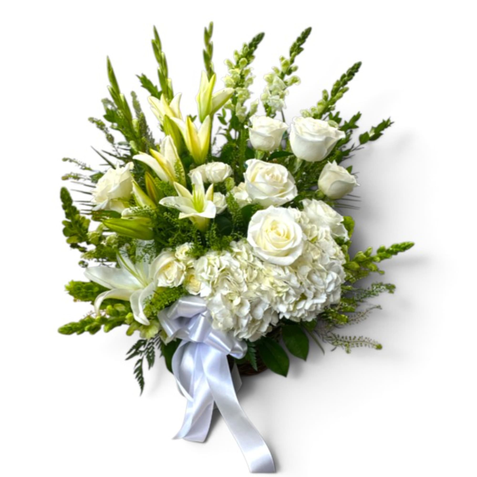 White roses and lilies arranged with a silver ribbon