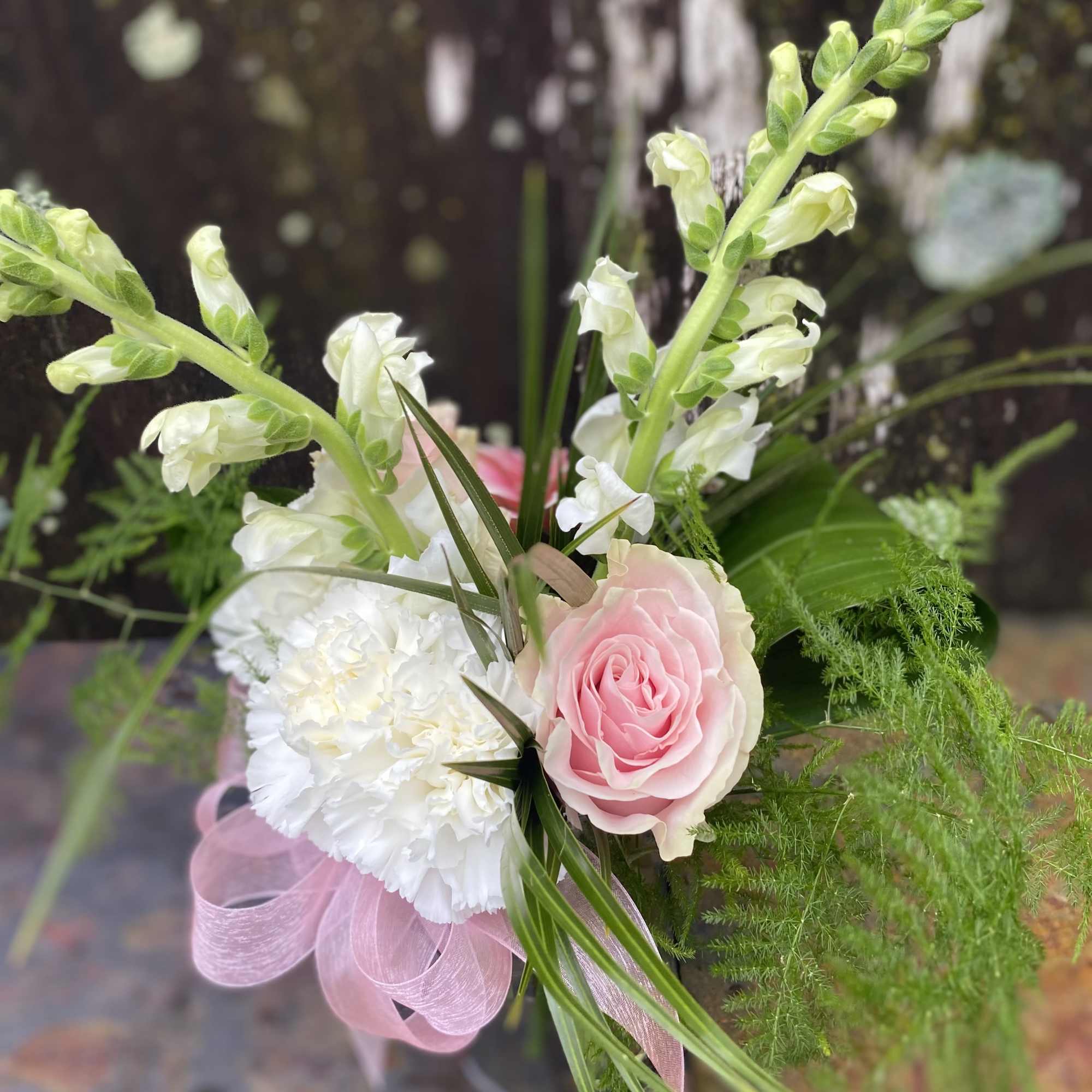 Pink rose and white carnation bouquet with tall white snapdragons
