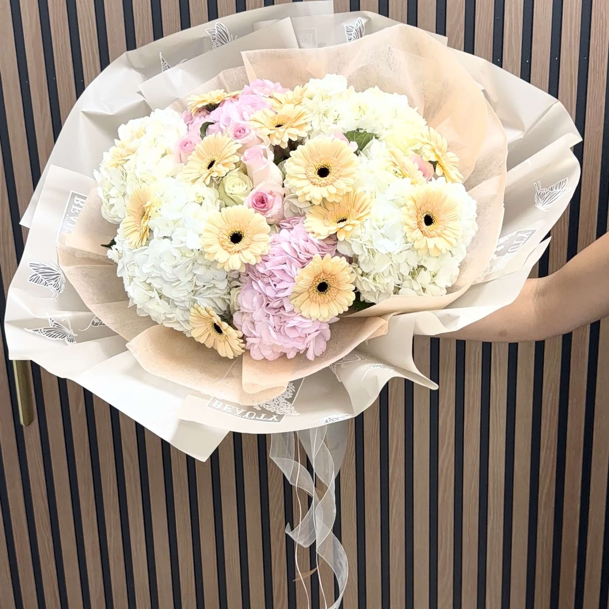 Soft, romantic pastels take center stage in this gerbera-and-hydrangea hand-tied bouquet-perfect as, photo 2 of 5