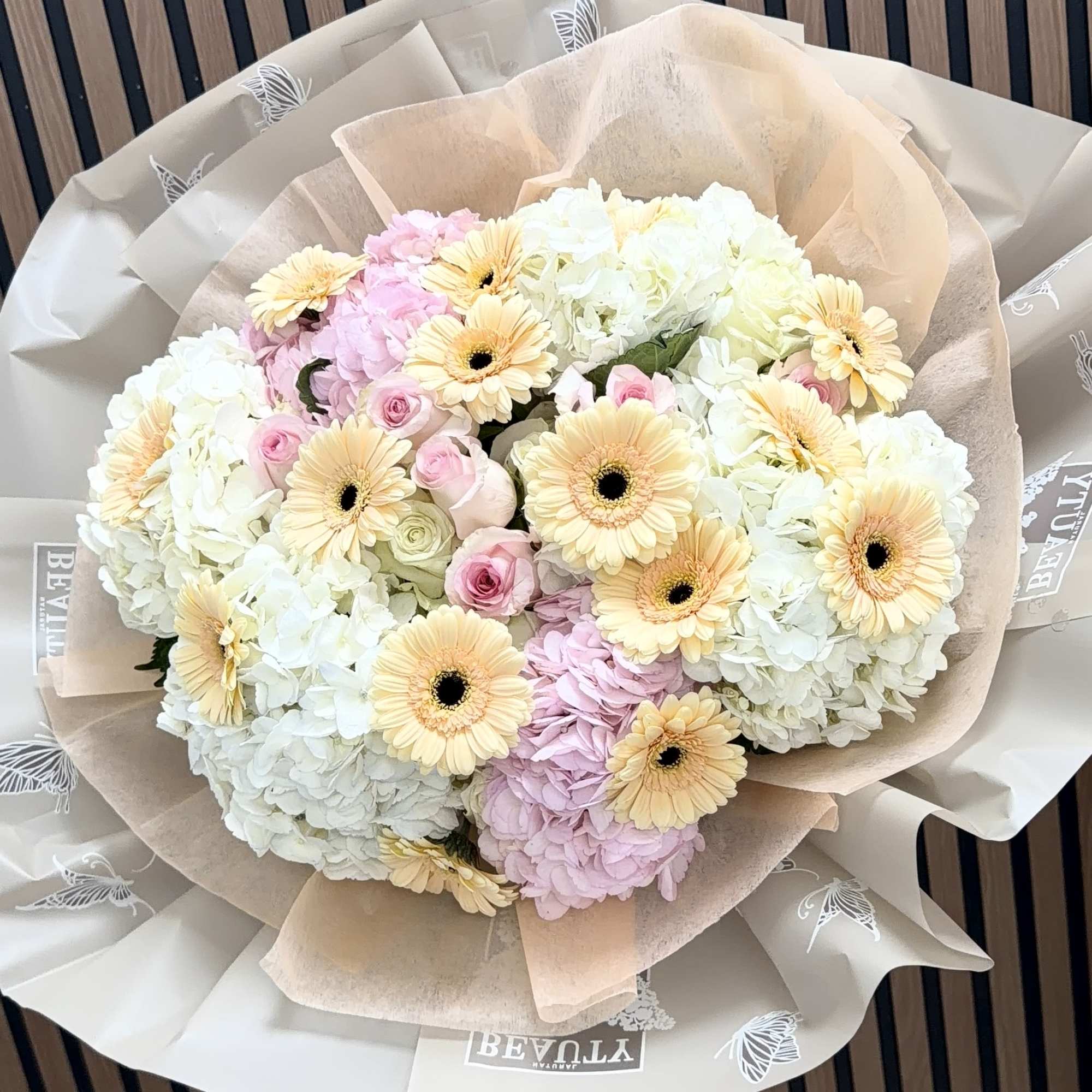 Soft, romantic pastels take center stage in this gerbera-and-hydrangea hand-tied bouquet-perfect as, photo 3 of 5