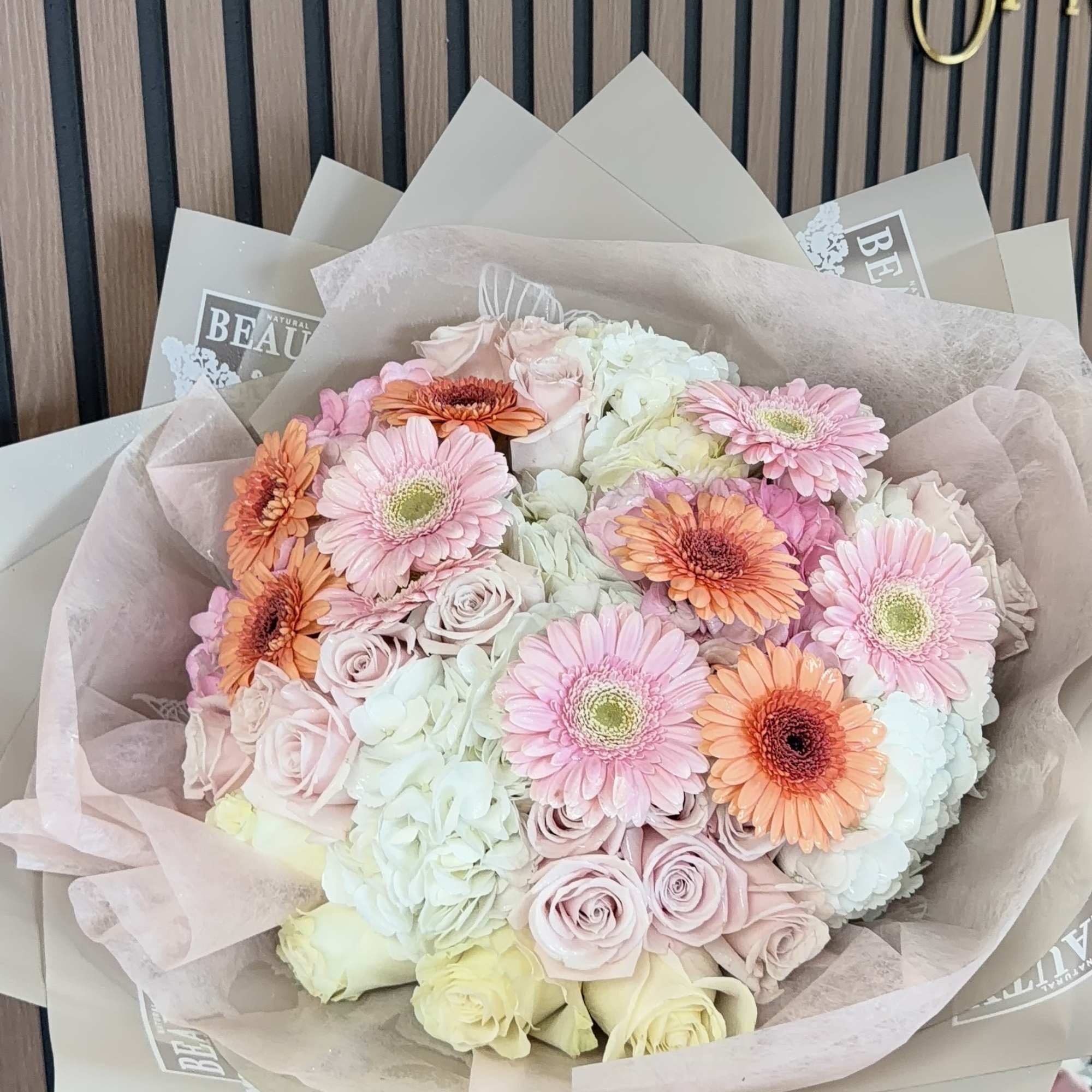Soft, romantic pastels take center stage in this gerbera-and-hydrangea hand-tied bouquet-perfect as, photo 5 of 5