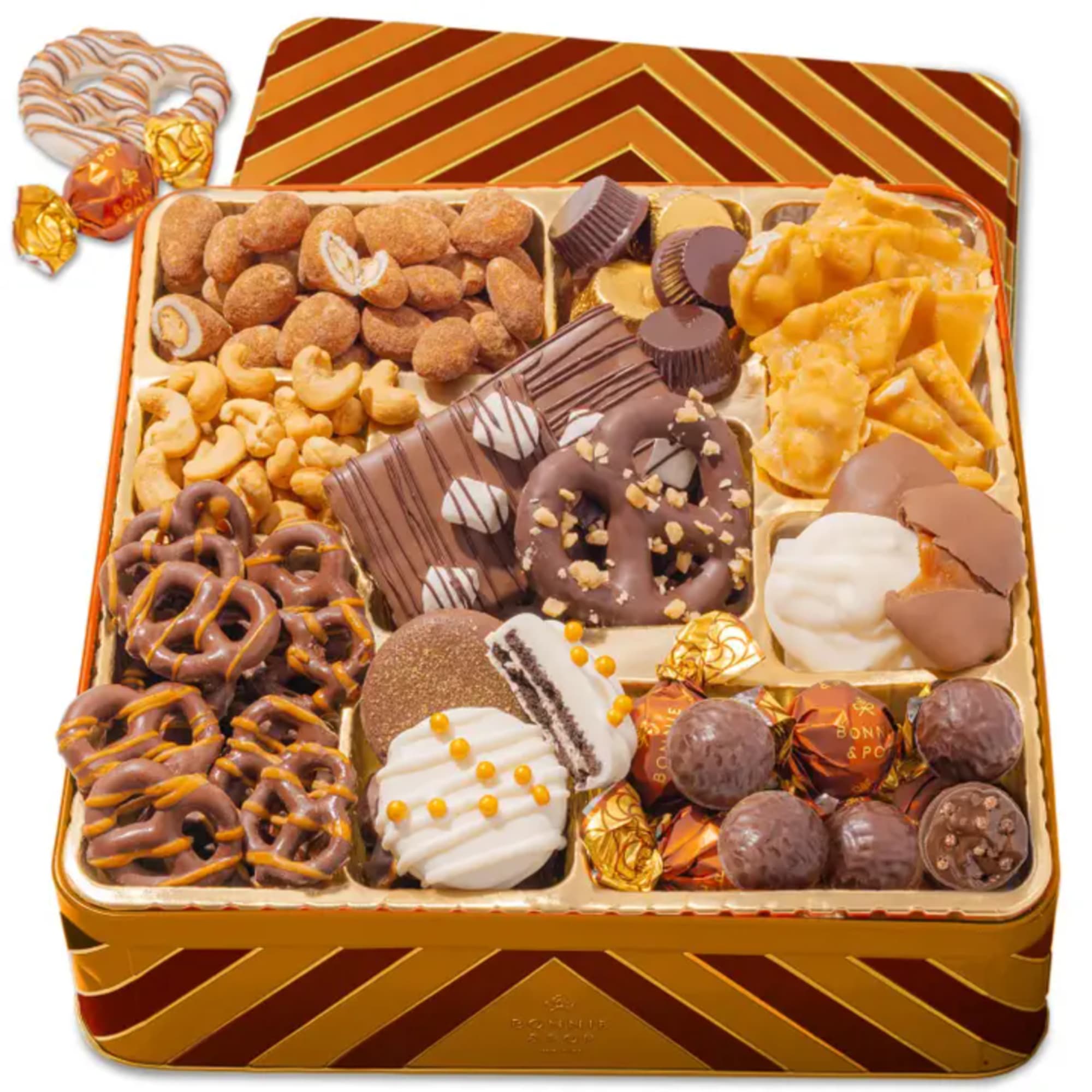 Assorted chocolates and snacks in a decorative gift tin