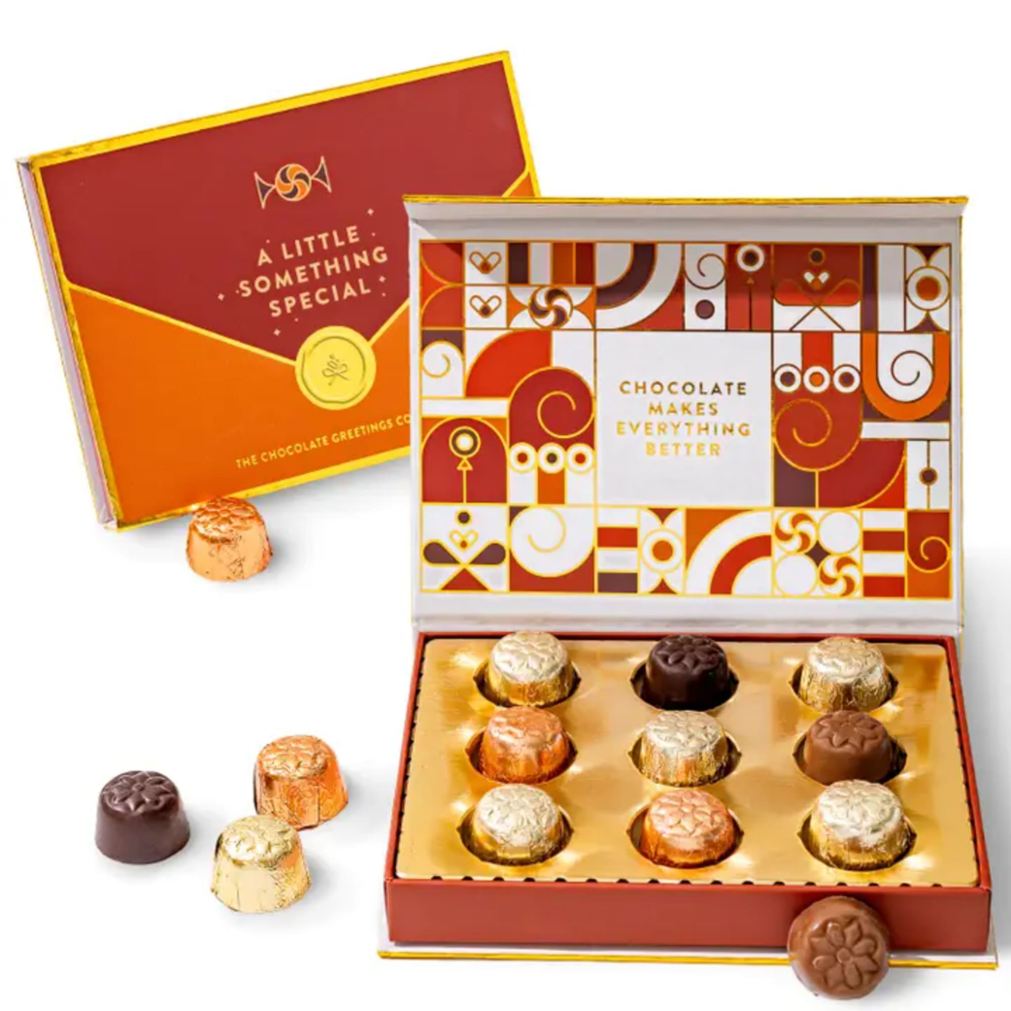 Box of assorted chocolates with several pieces outside the box