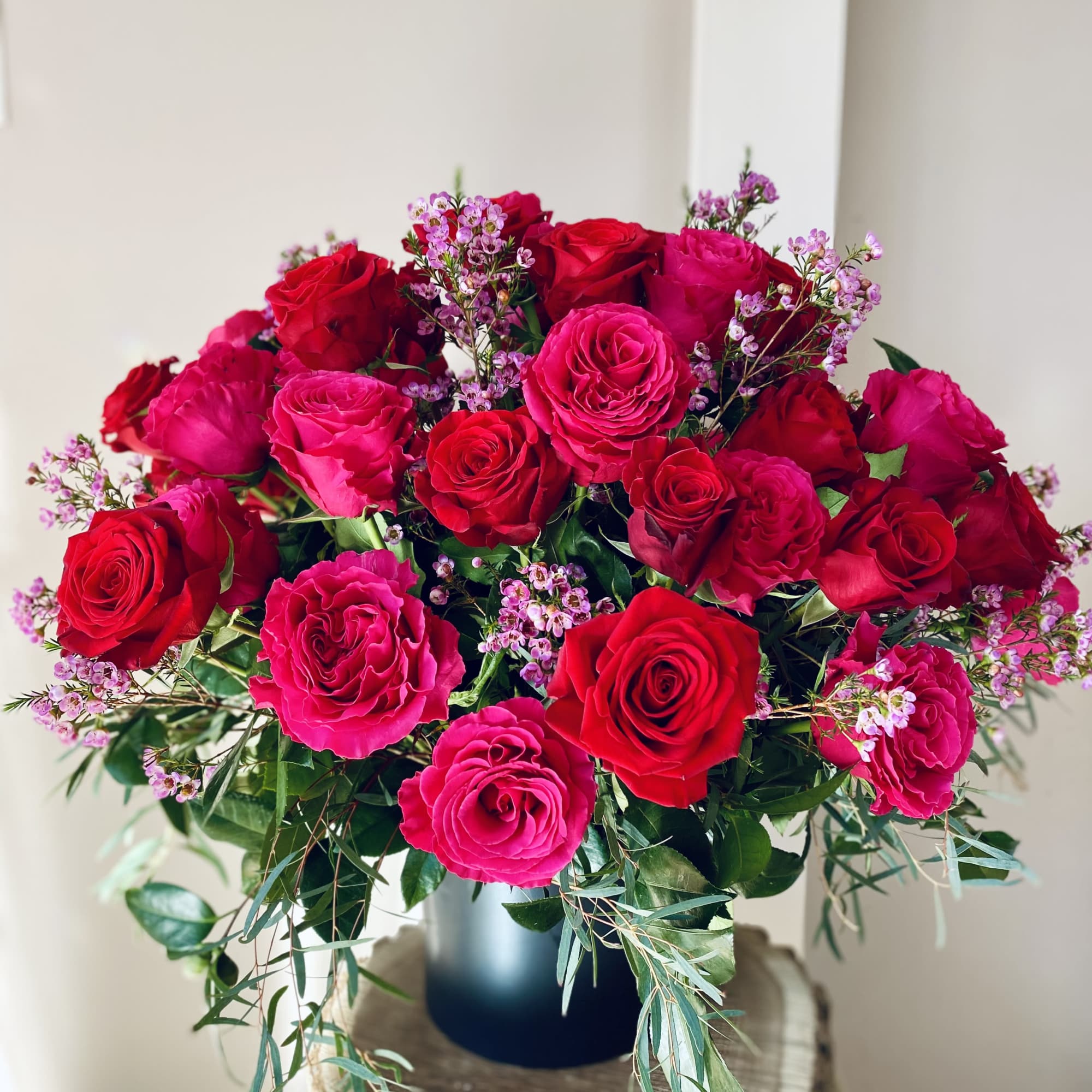 Bouquet of red and pink roses in a vase