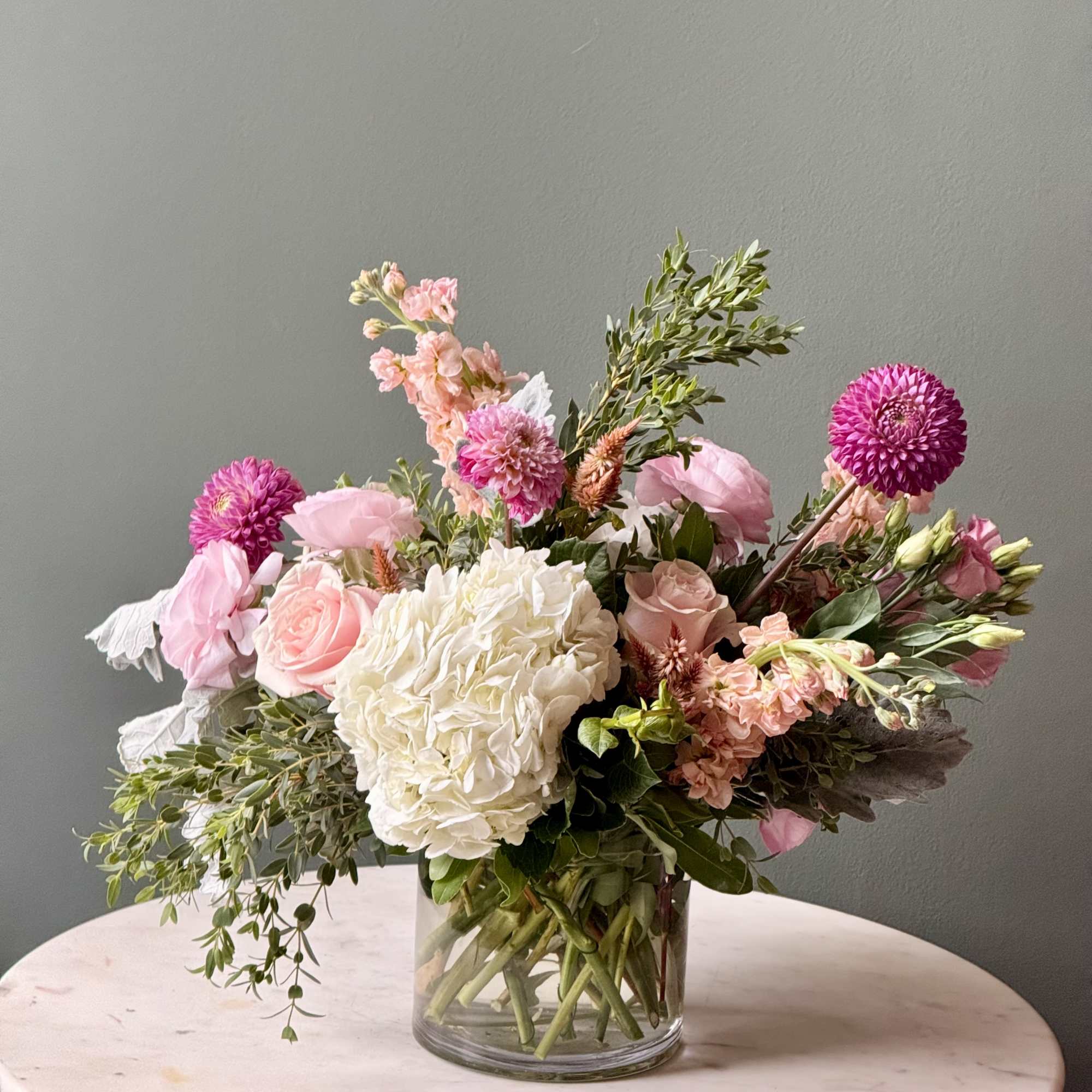Pink and white mixed bouquet in a clear glass vase