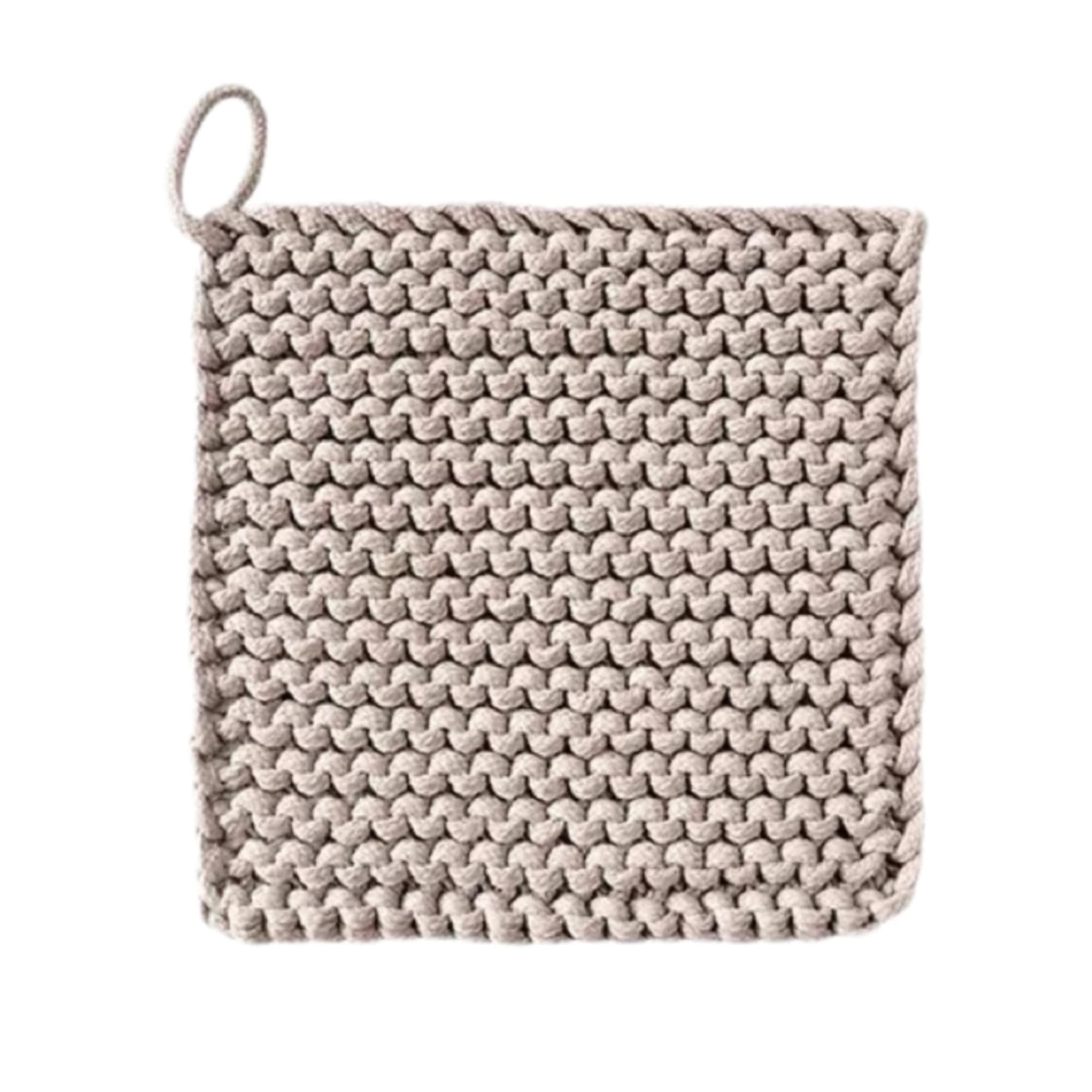 Beige woven basket with a loop handle on a white background