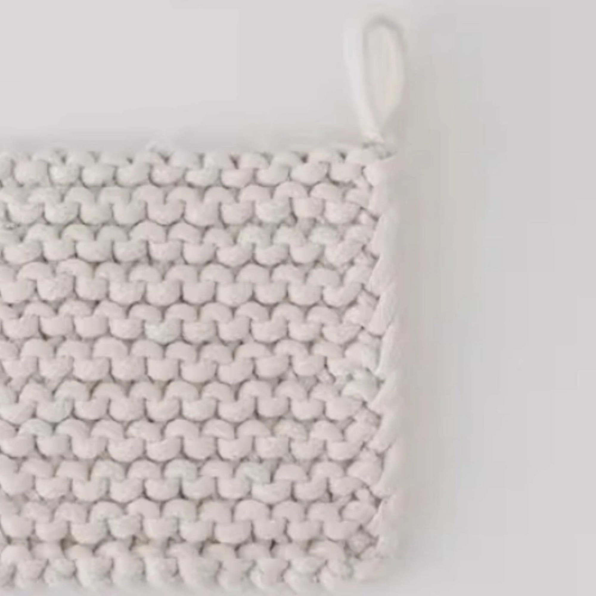 White woven basket with a loop handle