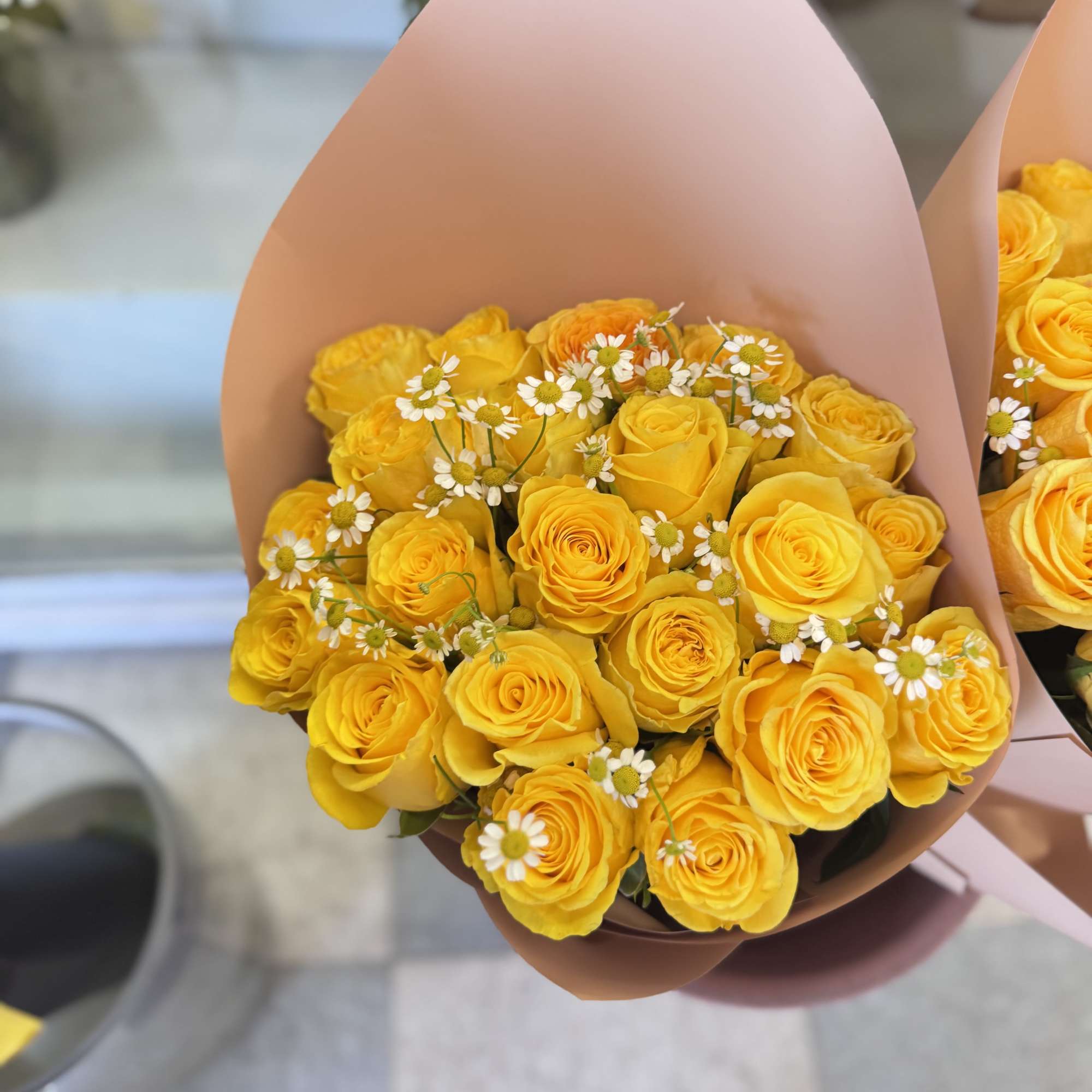 Beautiful stunning Yellow roses bouquet wrapped in black or brown with some