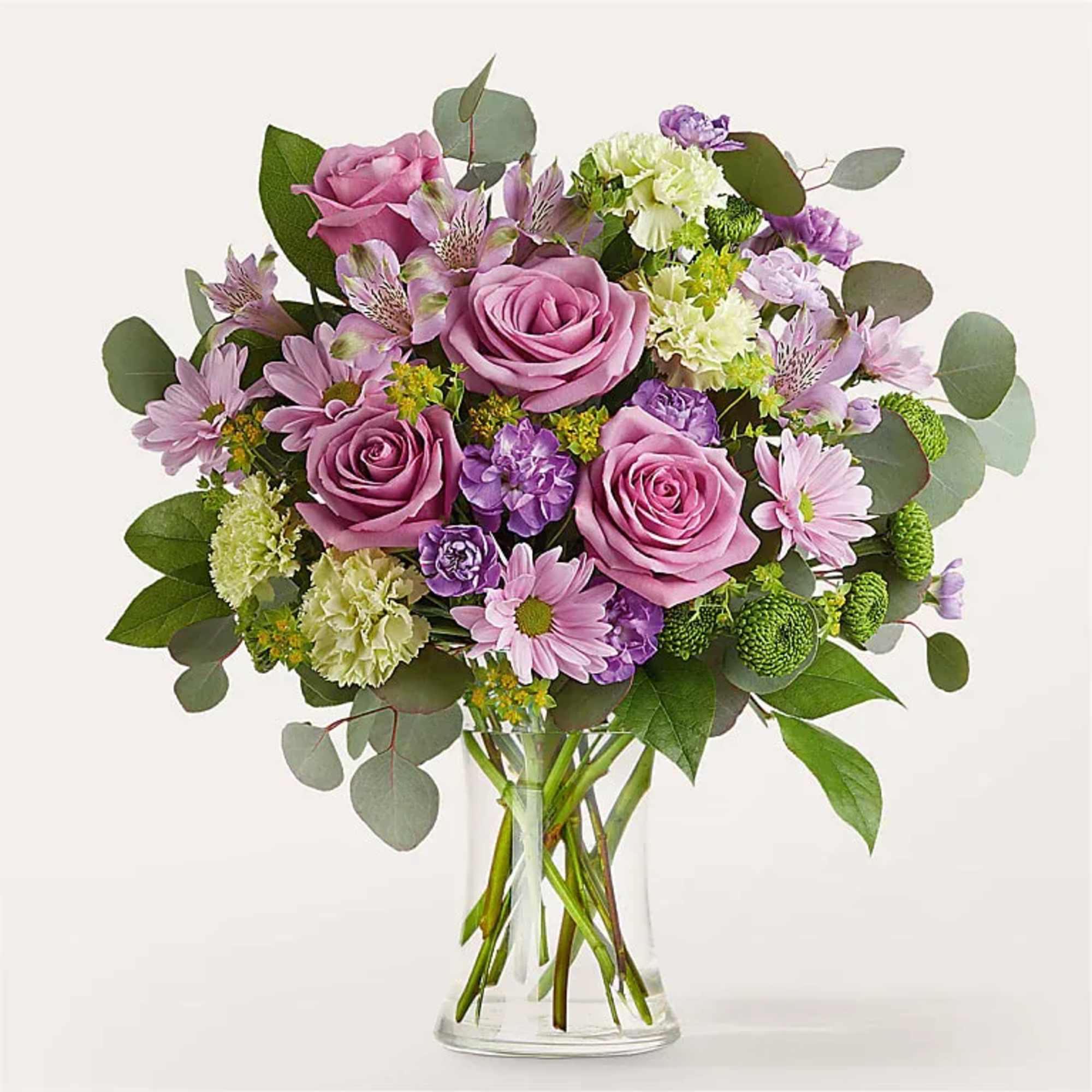 An opulent design featuring the eye catching contrast of soft lavender blooms