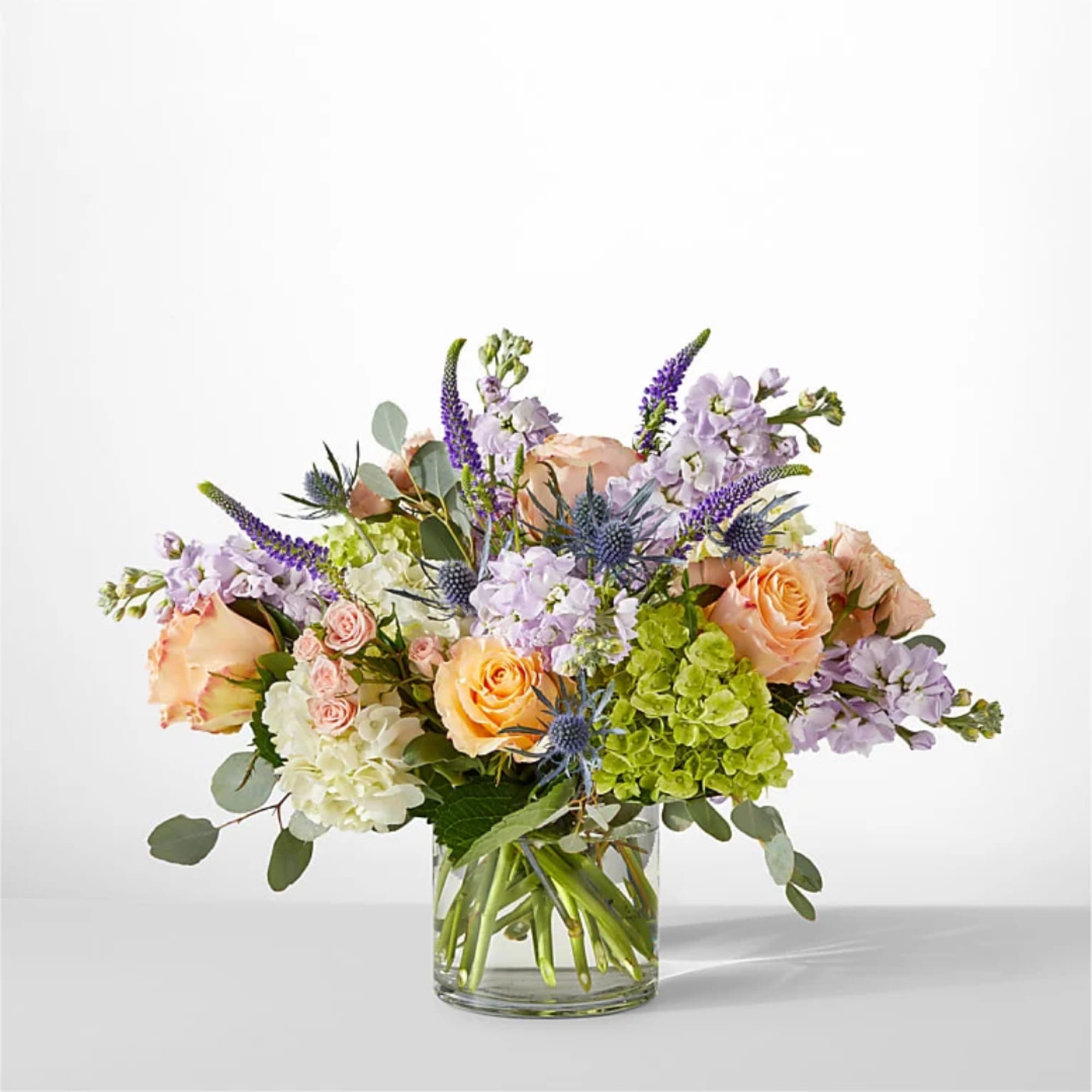 Pastel flower arrangement in a clear glass vase