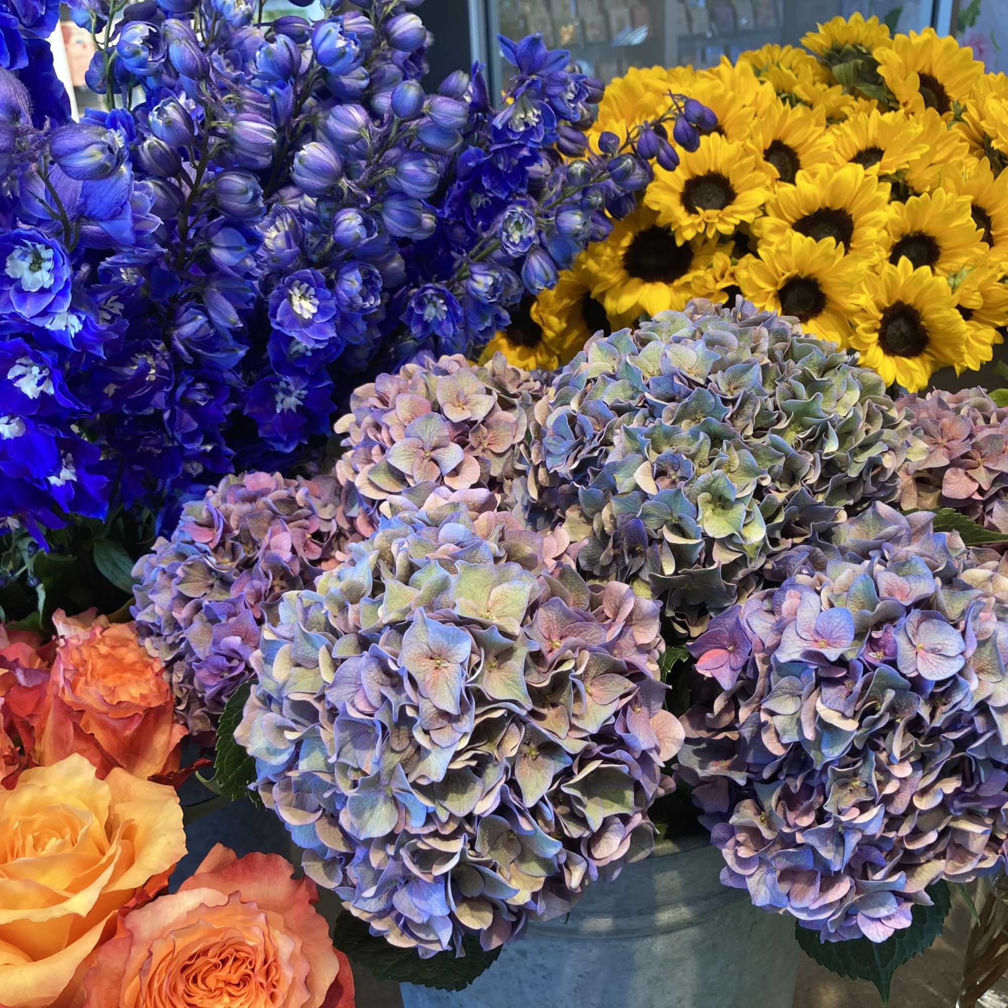 The freshest flowers and greens of the season are artfully arranged by
