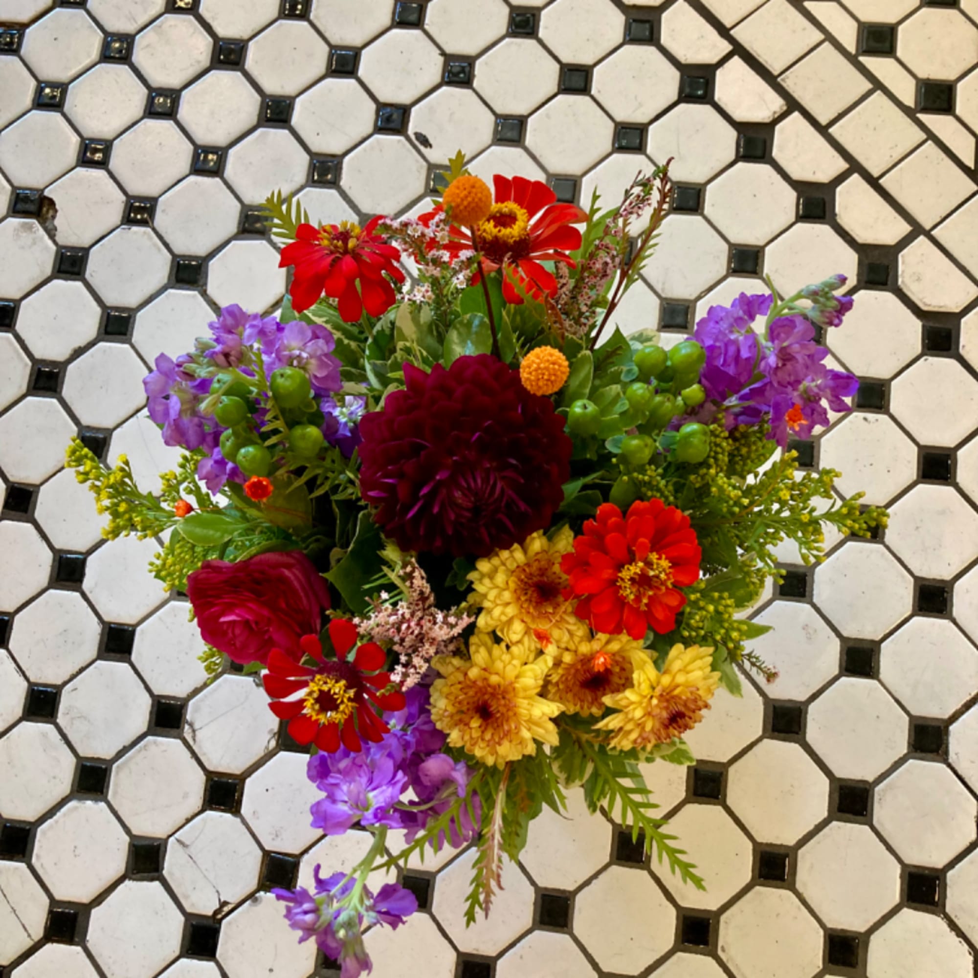 Colorful mixed bouquet with red, purple, and yellow flowers