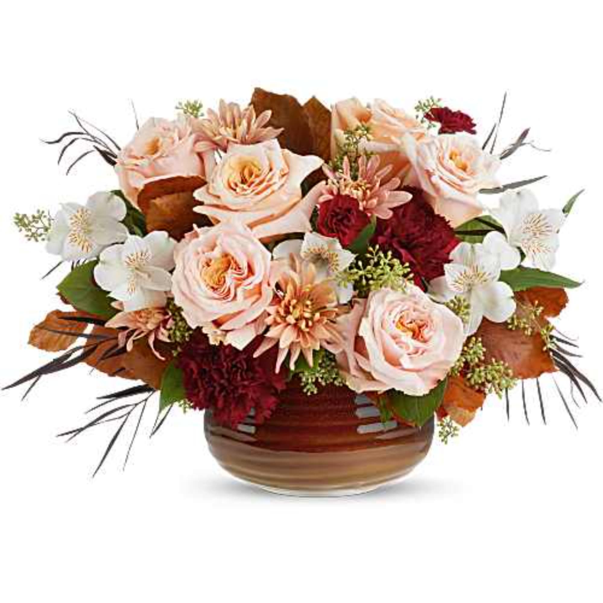 Arrangement of pale pink roses and white flowers in a brown glass vase