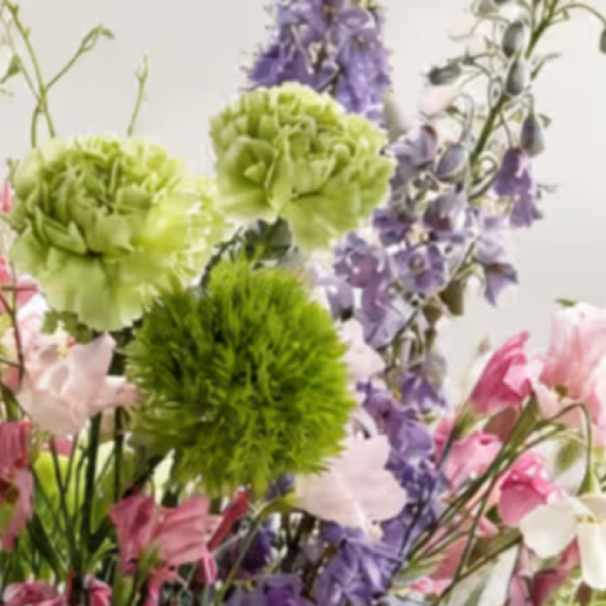 Mixed bouquet with green and purple flowers