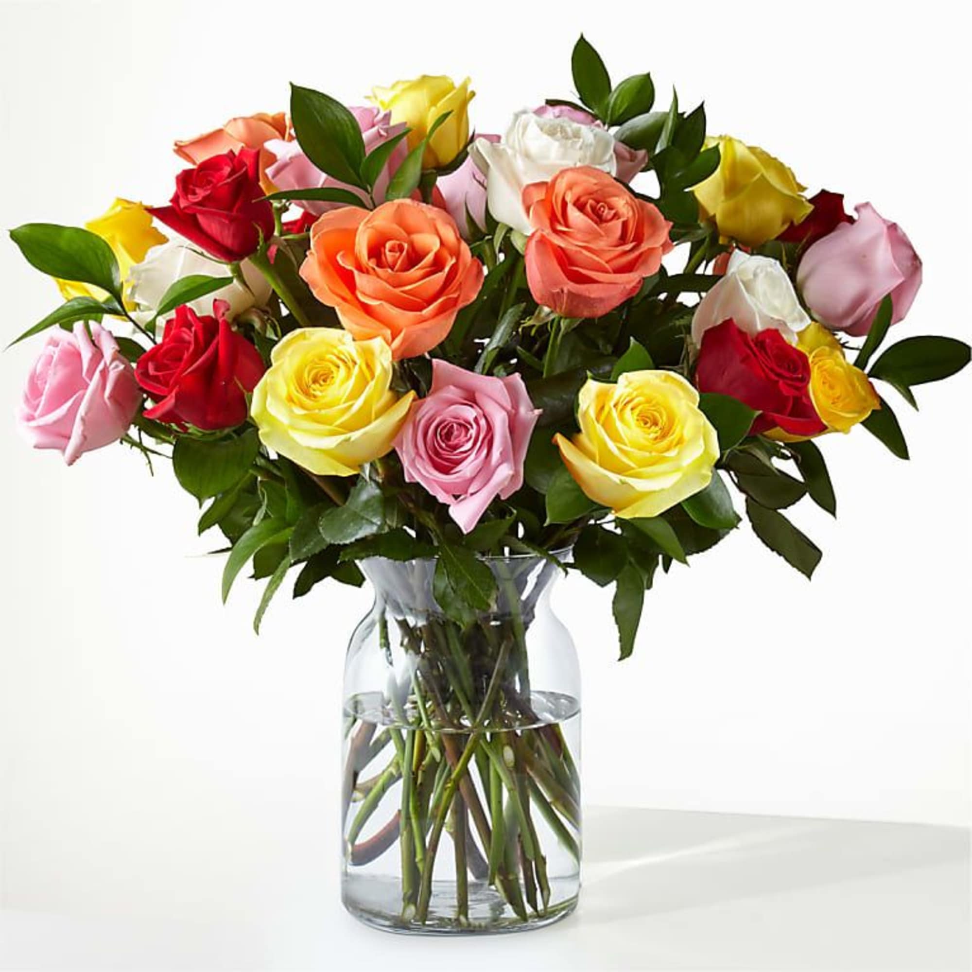 Mixed roses in a clear glass vase