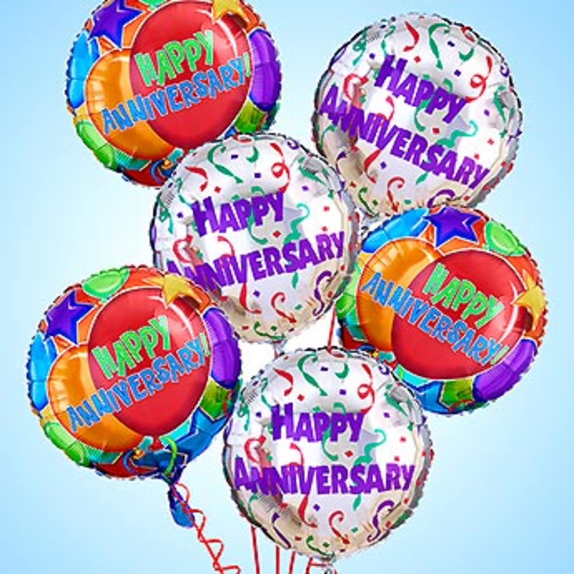 Cluster of colorful anniversary balloons with confetti patterns