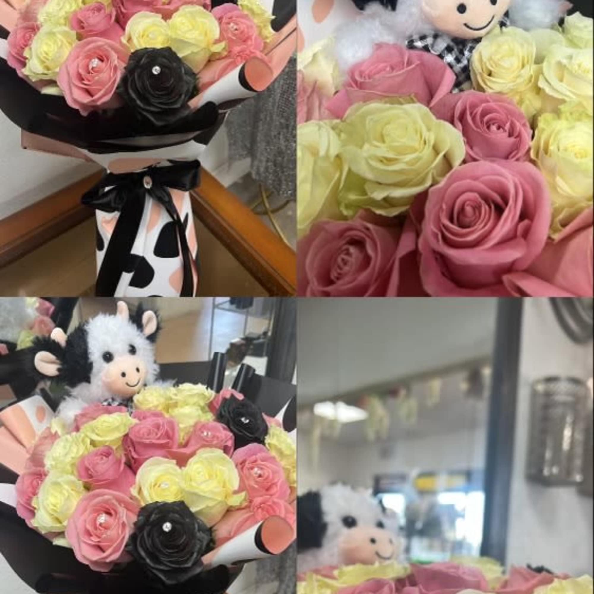 Bouquet of pink, yellow, and black roses with a plush cow topper