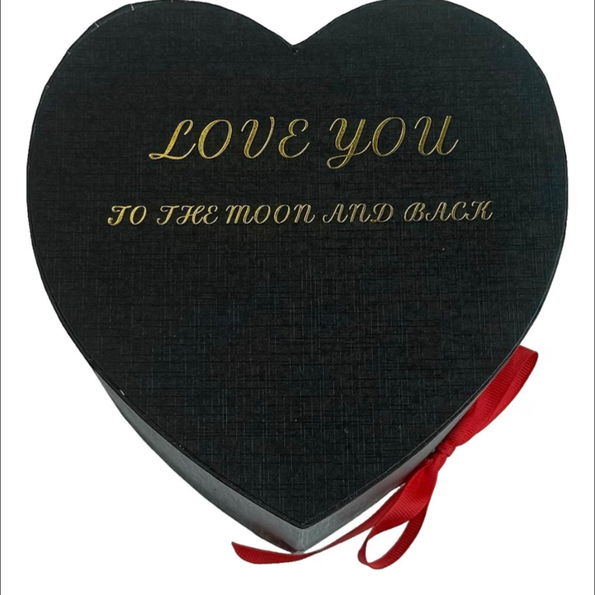 Heart-shaped black gift box with gold lettering and a red ribbon