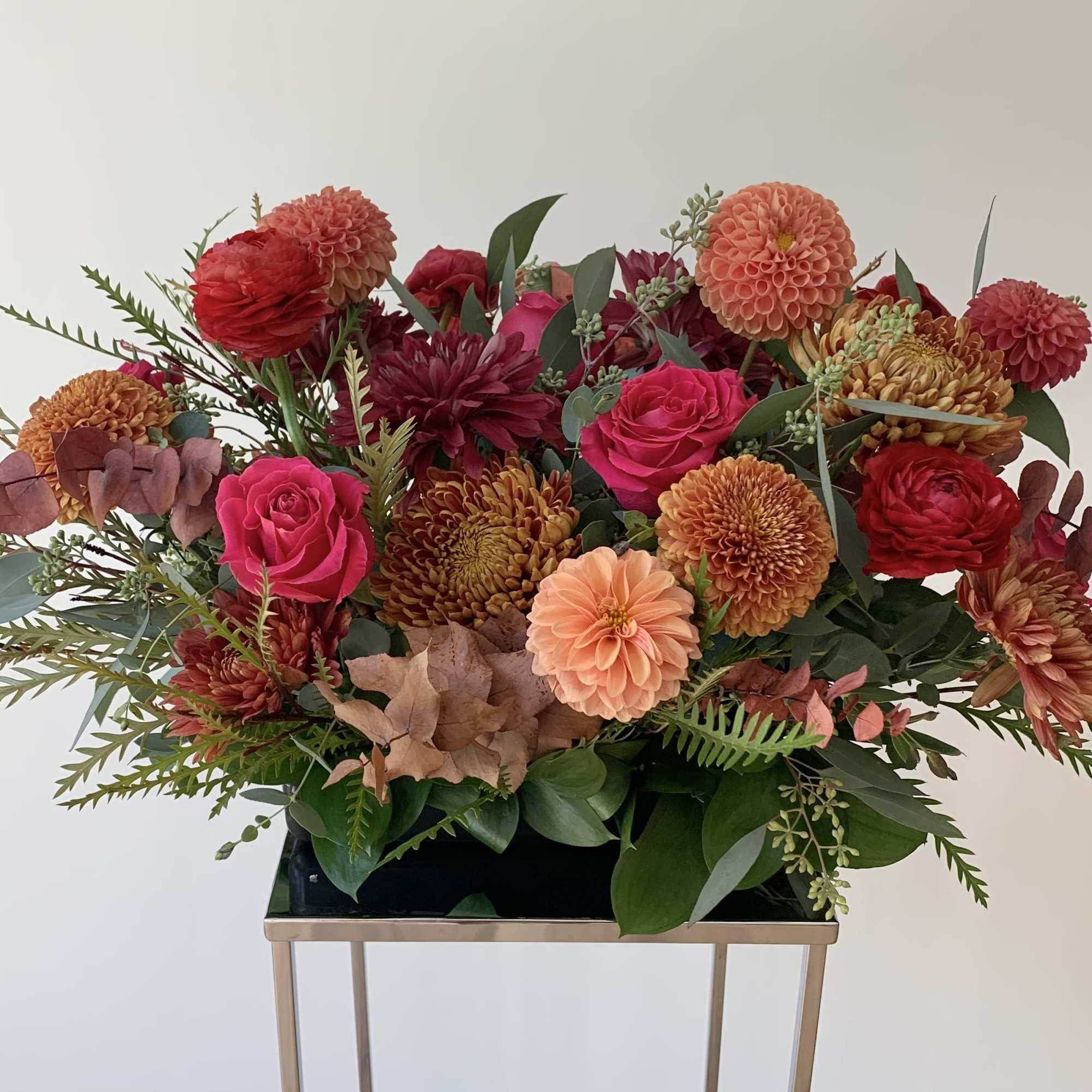 A beautiful seasonal table arrangement designed in a 10x5inch tray, with premium