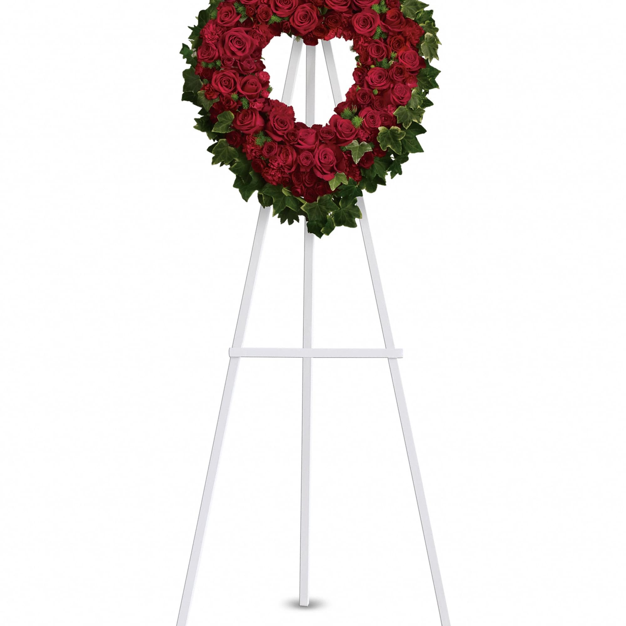 Heart-shaped red rose wreath on a white easel