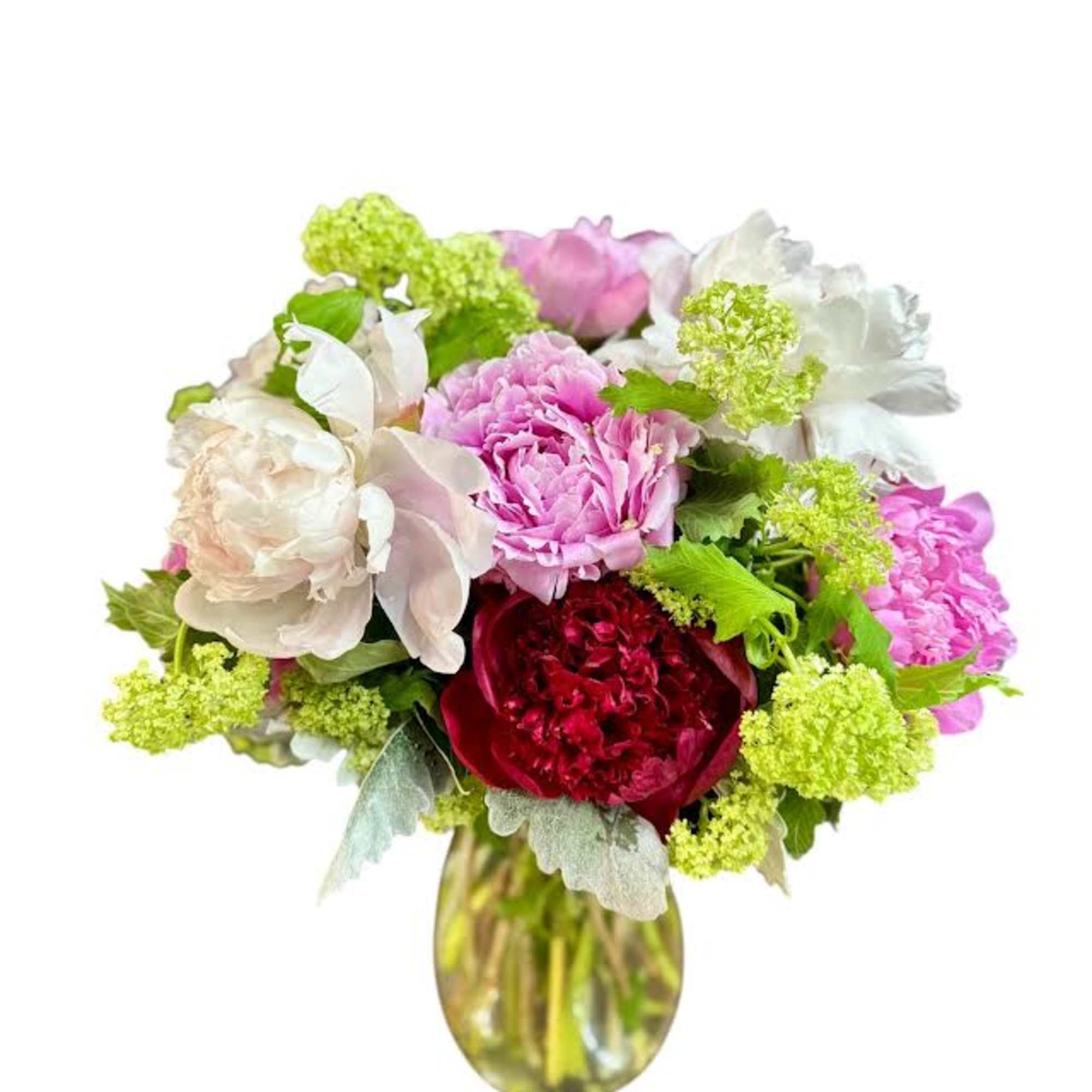 Bouquet of pink, white, and red flowers in a glass vase