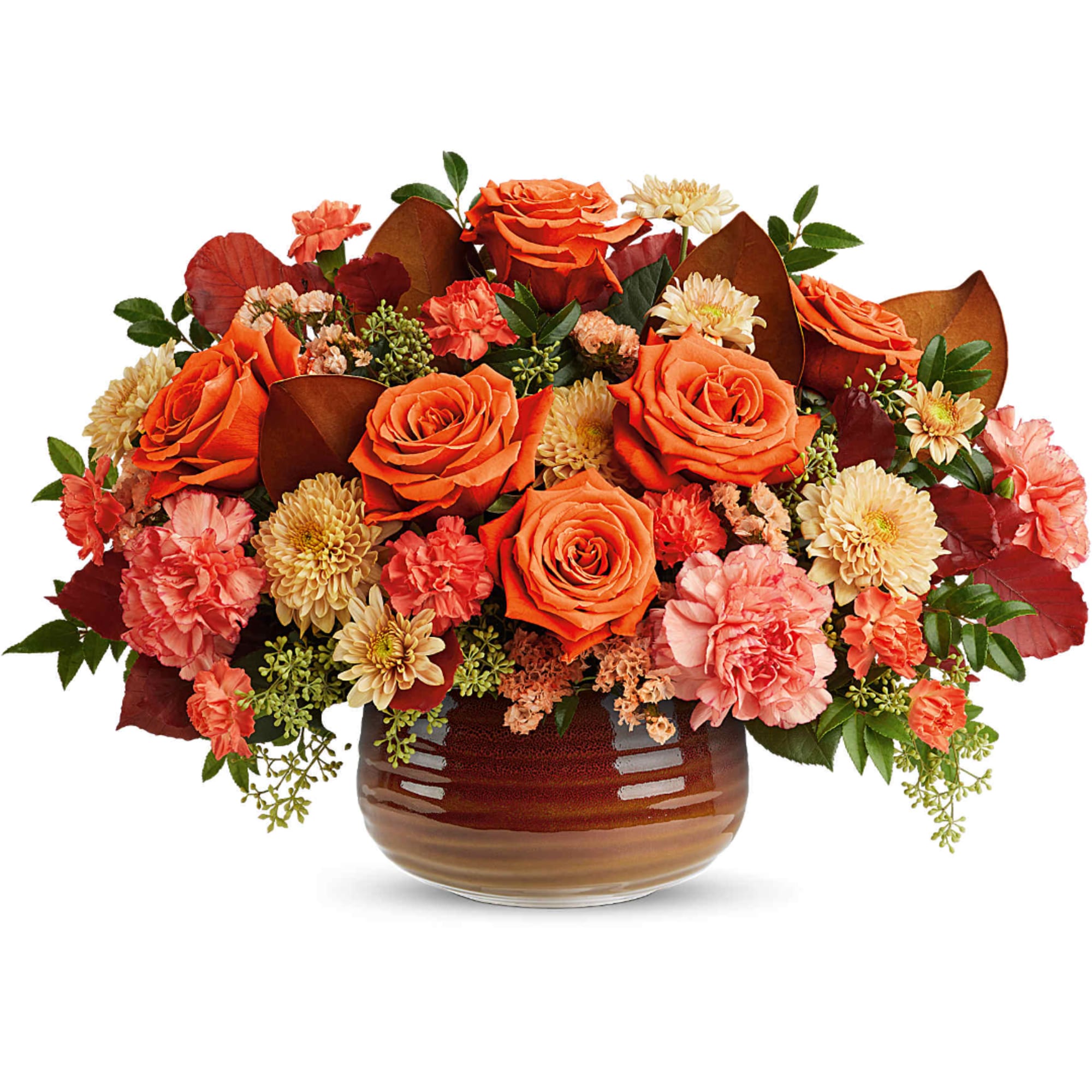 Orange roses and peach carnations in a brown glass vase