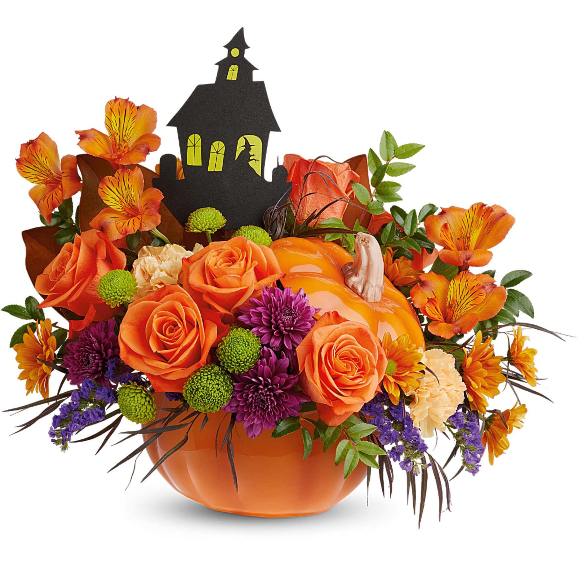 Orange floral arrangement in a pumpkin container with a haunted house pick