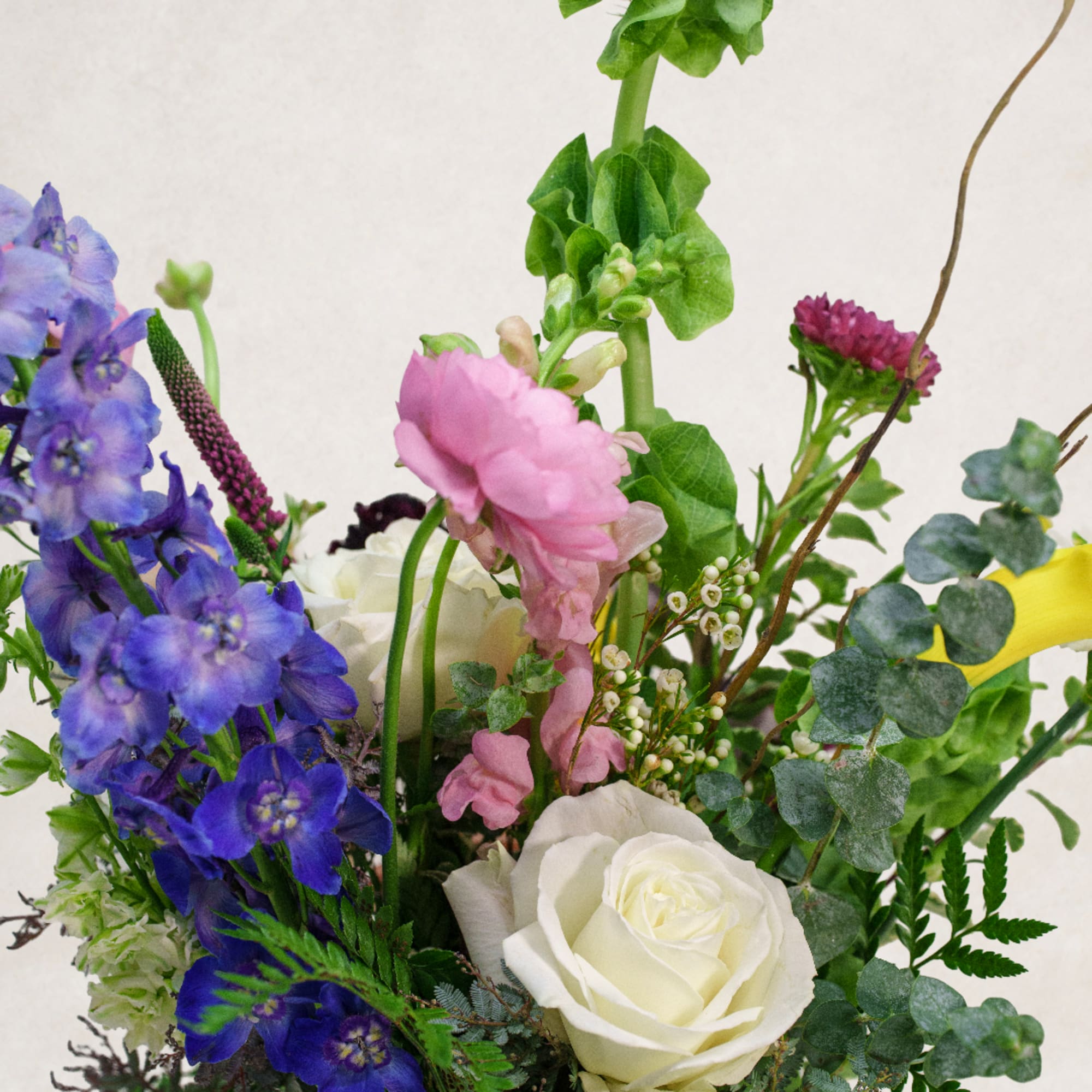 Mixed bouquet with blue, pink, and white flowers