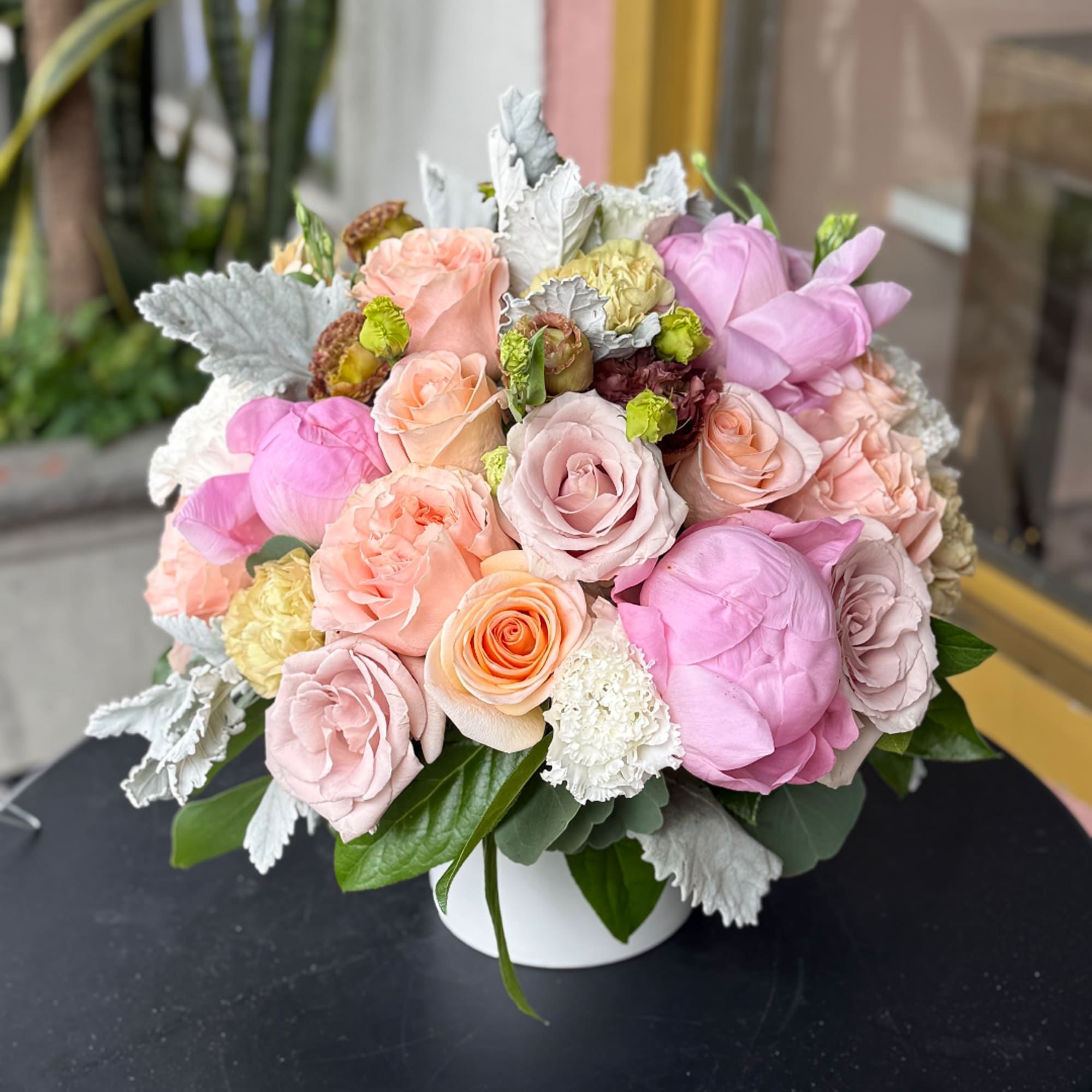 Pastel rose bouquet in a white vase