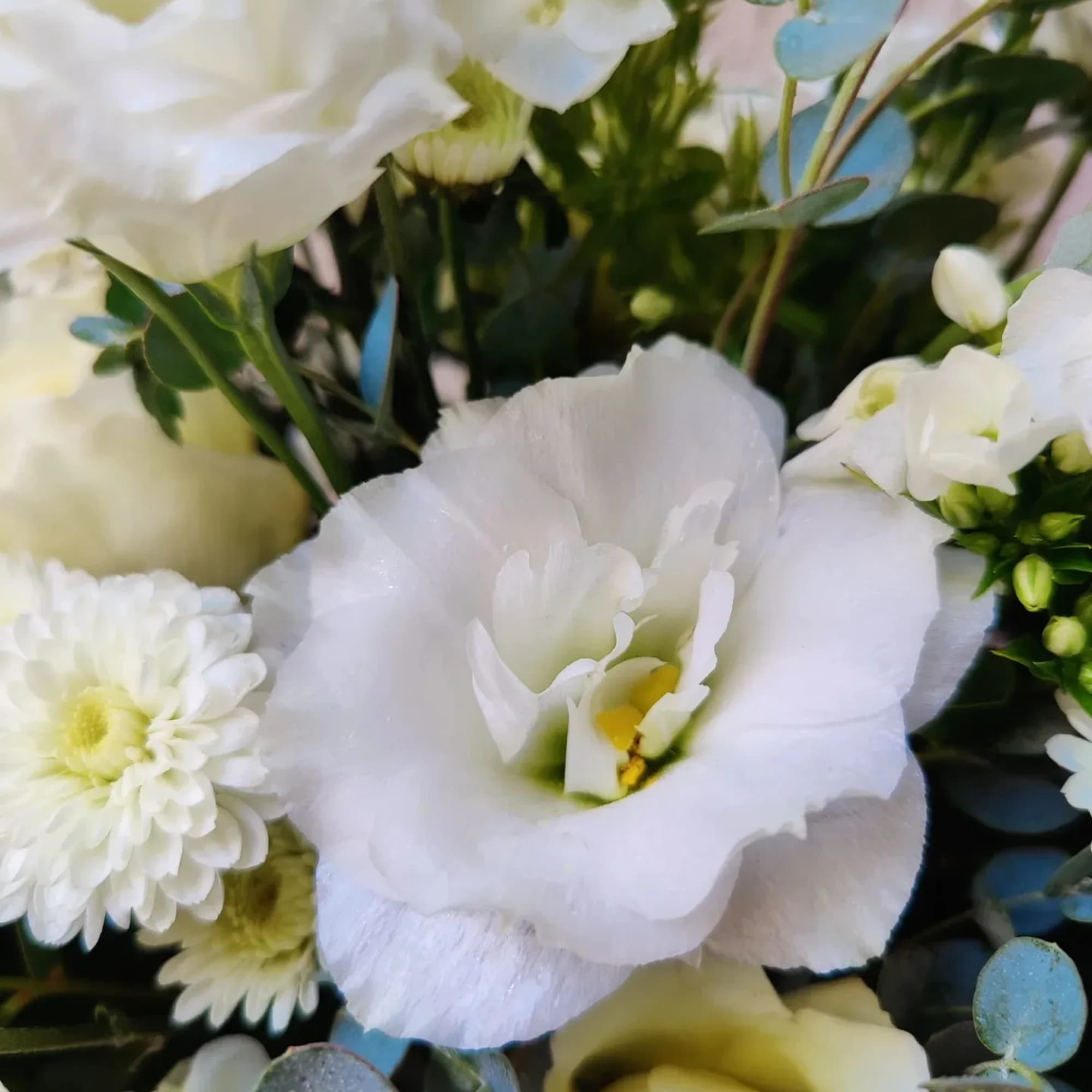 White bouquet with lisianthus, daisies, and eucalyptus