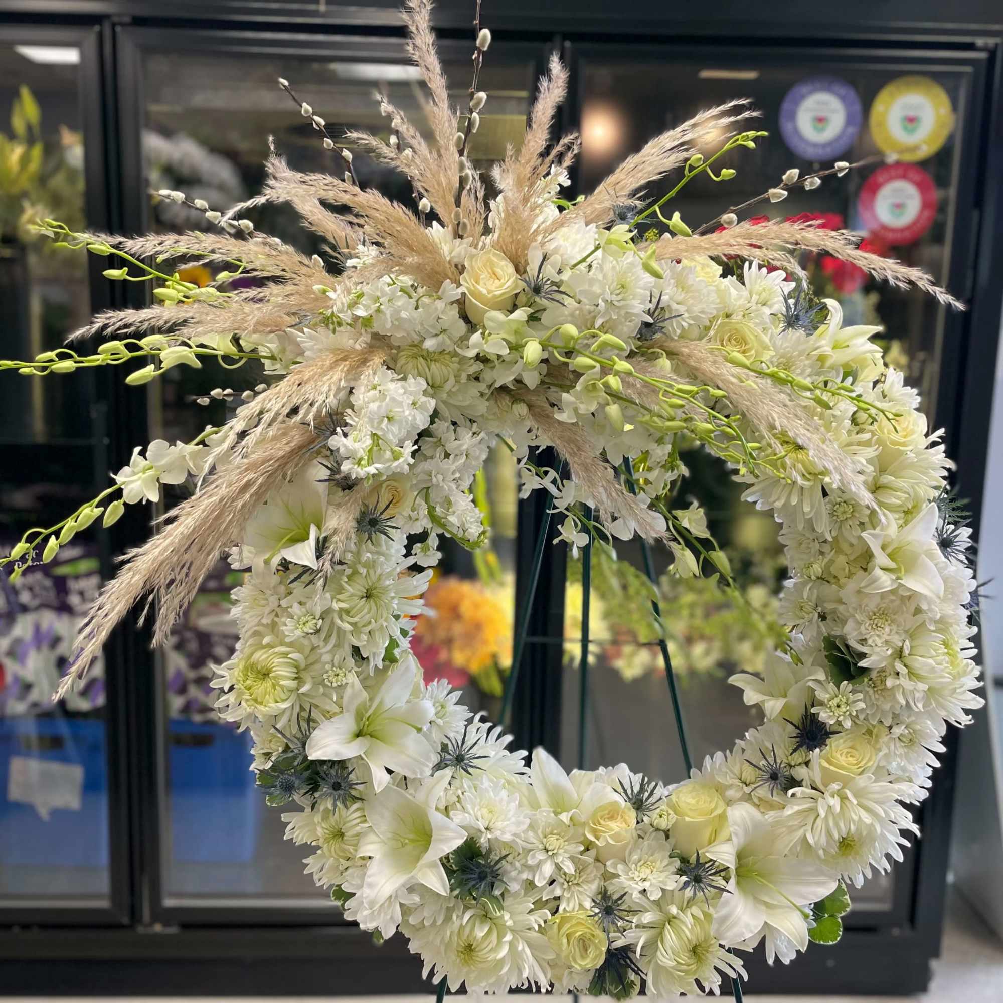 This large classic wreath is delivered on an easel, and is a