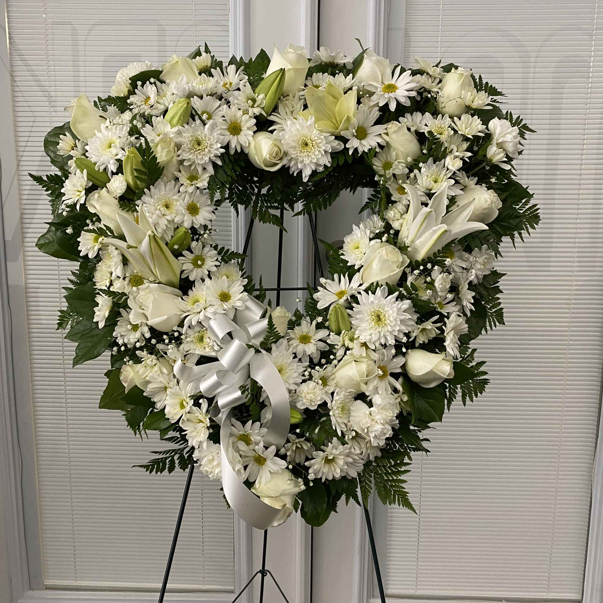 Celebrate a beautiful life while expressing your most heartfelt sympathy. This exquisitely