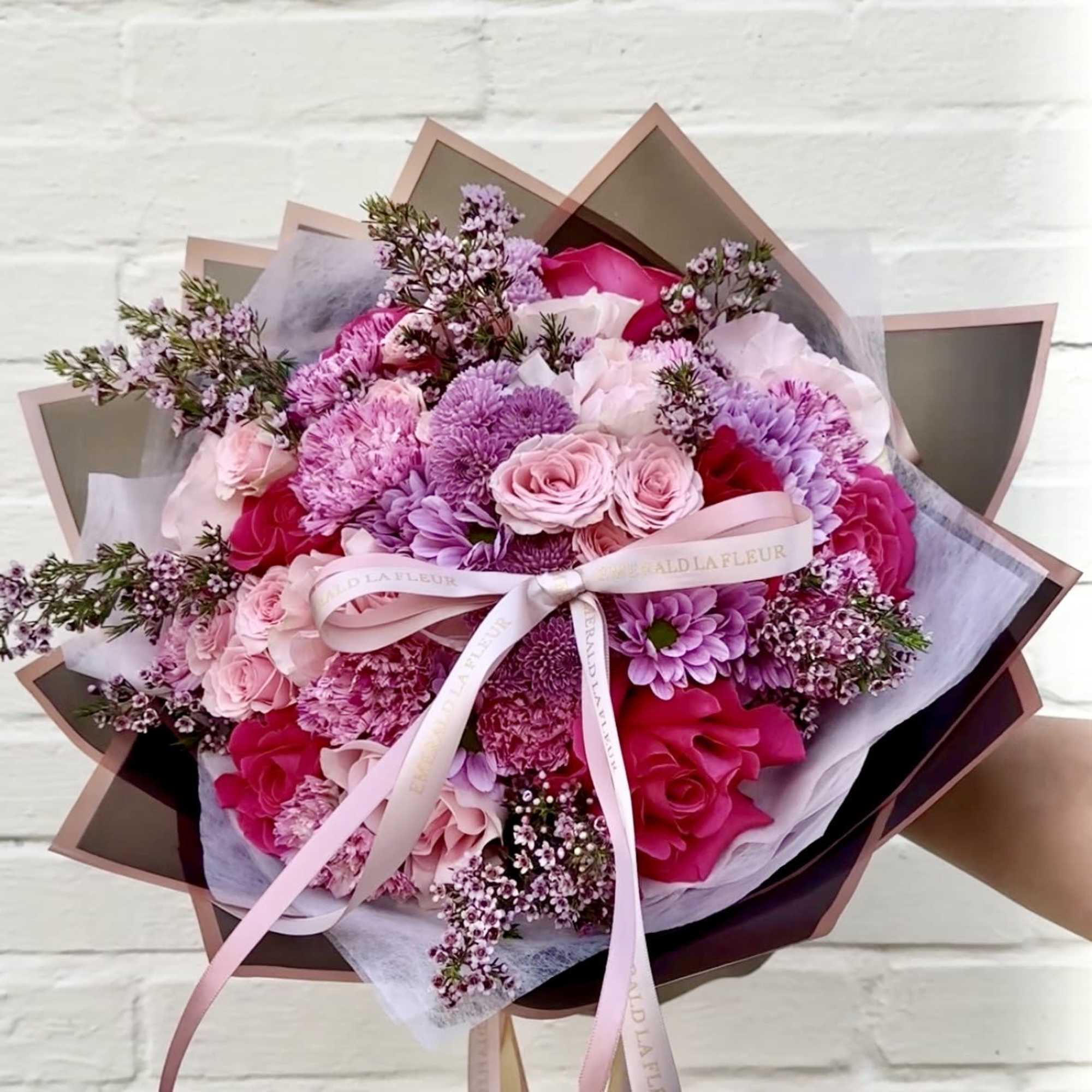 A refined hand wrapped bouquet designed to make every moment feel special.