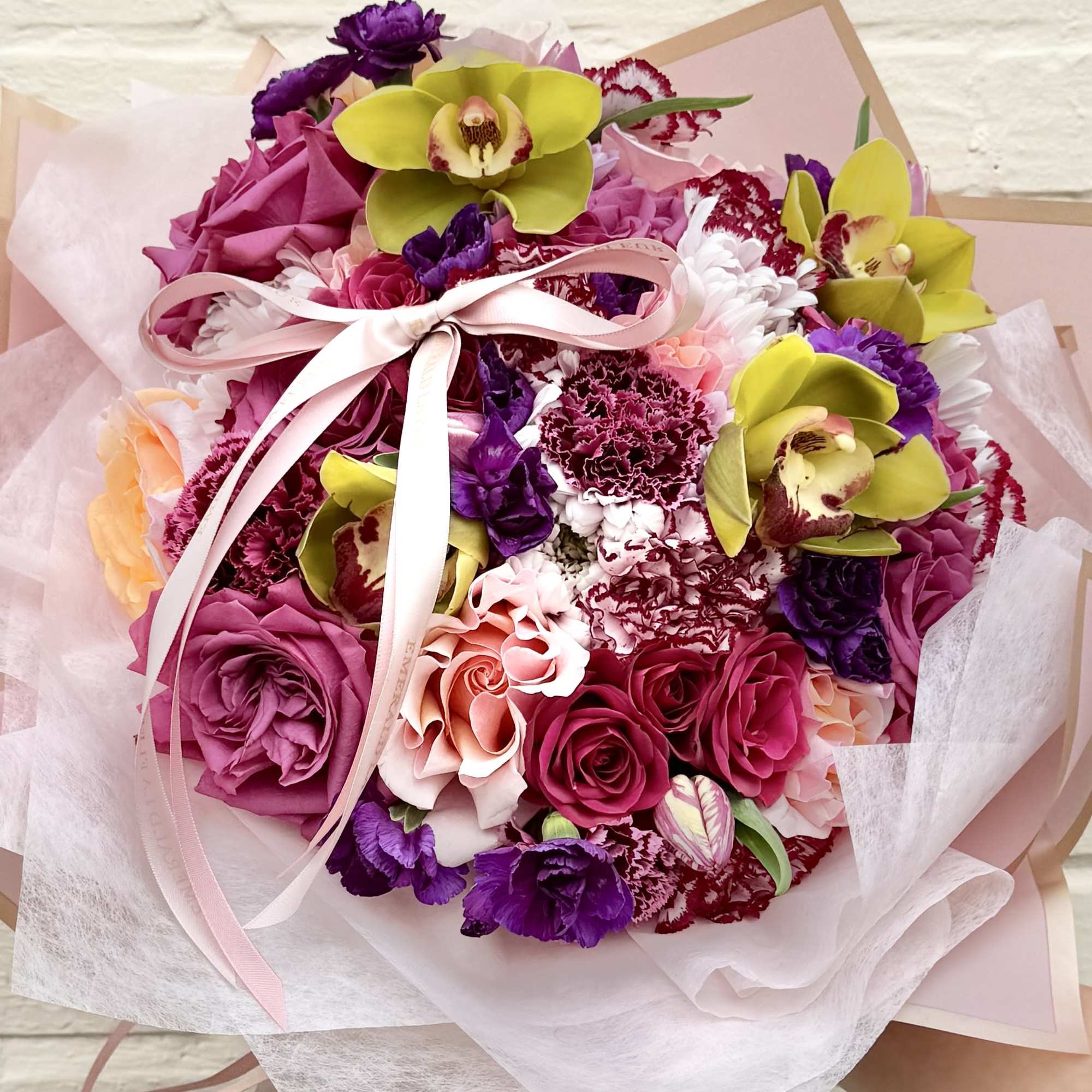 A refined hand wrapped bouquet designed to make every moment feel special.