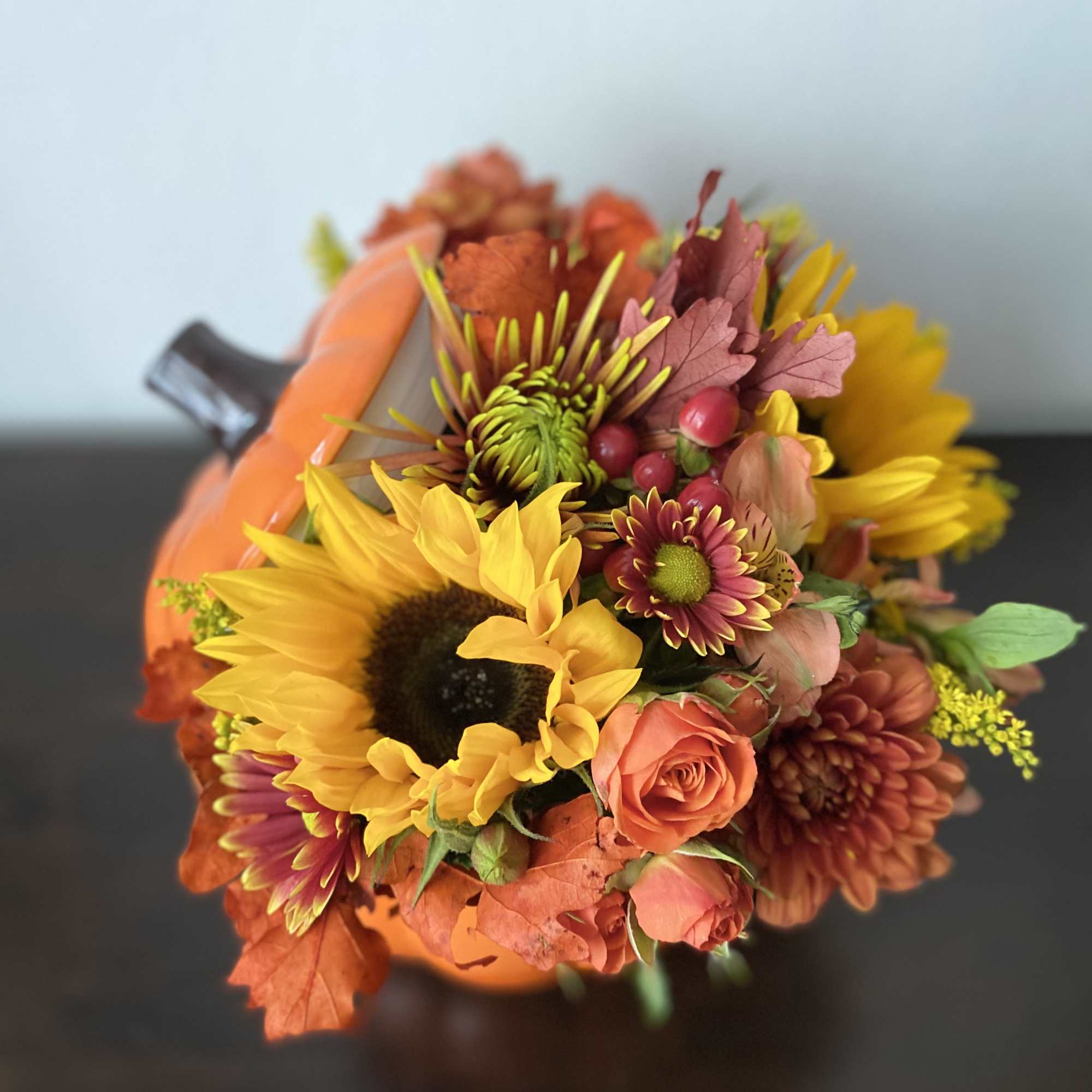 Approximately 11&rdquo; wide, 10&rdquo; tall 

Festive pumpkin with spray roses moms, sunflowers, photo 3 of 4