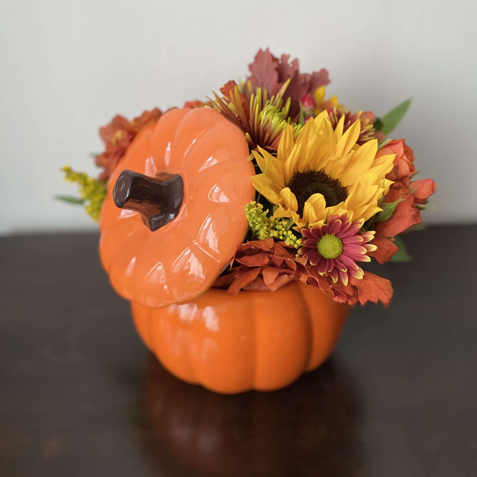 Approximately 11&rdquo; wide, 10&rdquo; tall 

Festive pumpkin with spray roses moms, sunflowers, photo 2 of 4