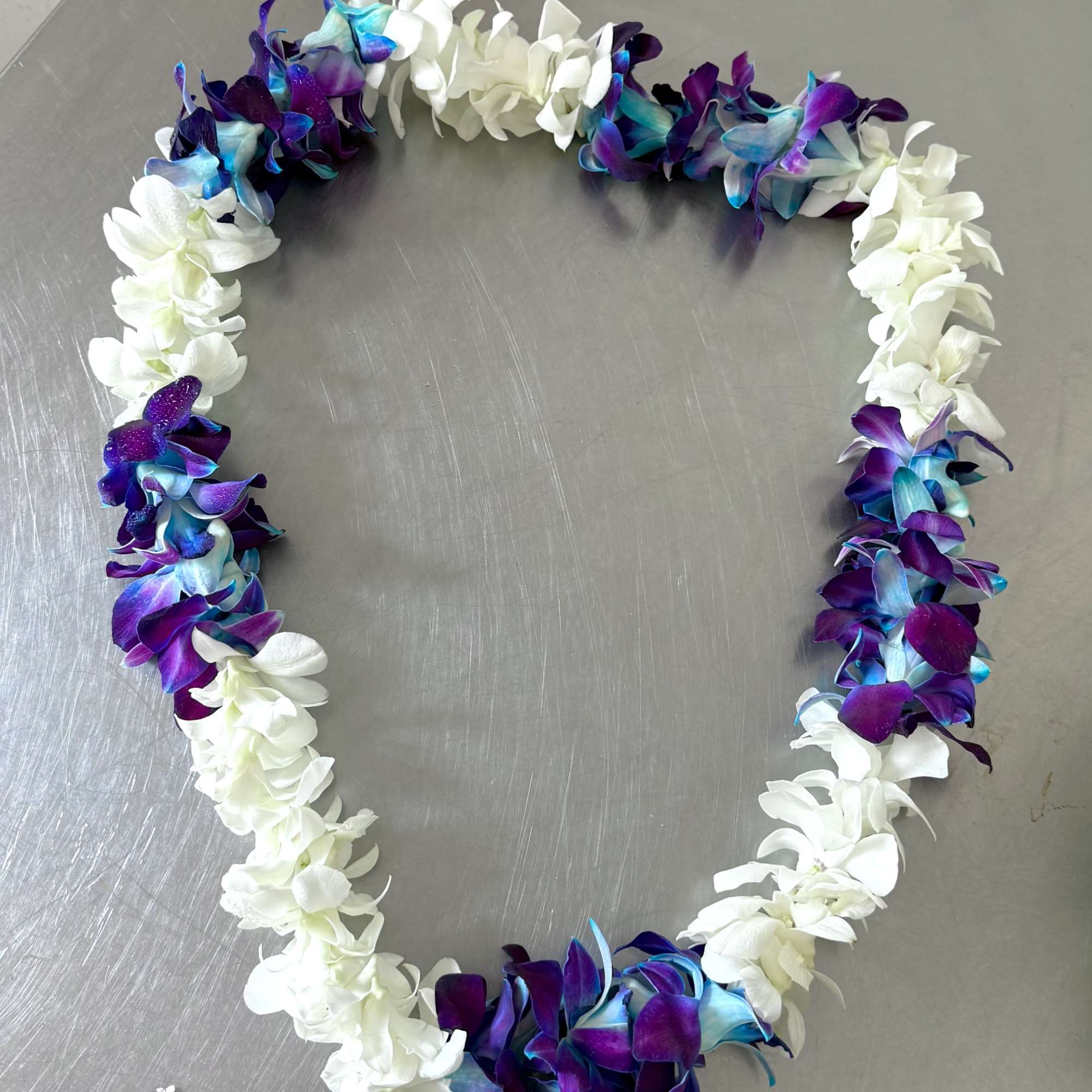 Single strand blue and white Dendrobium Orchid Lei