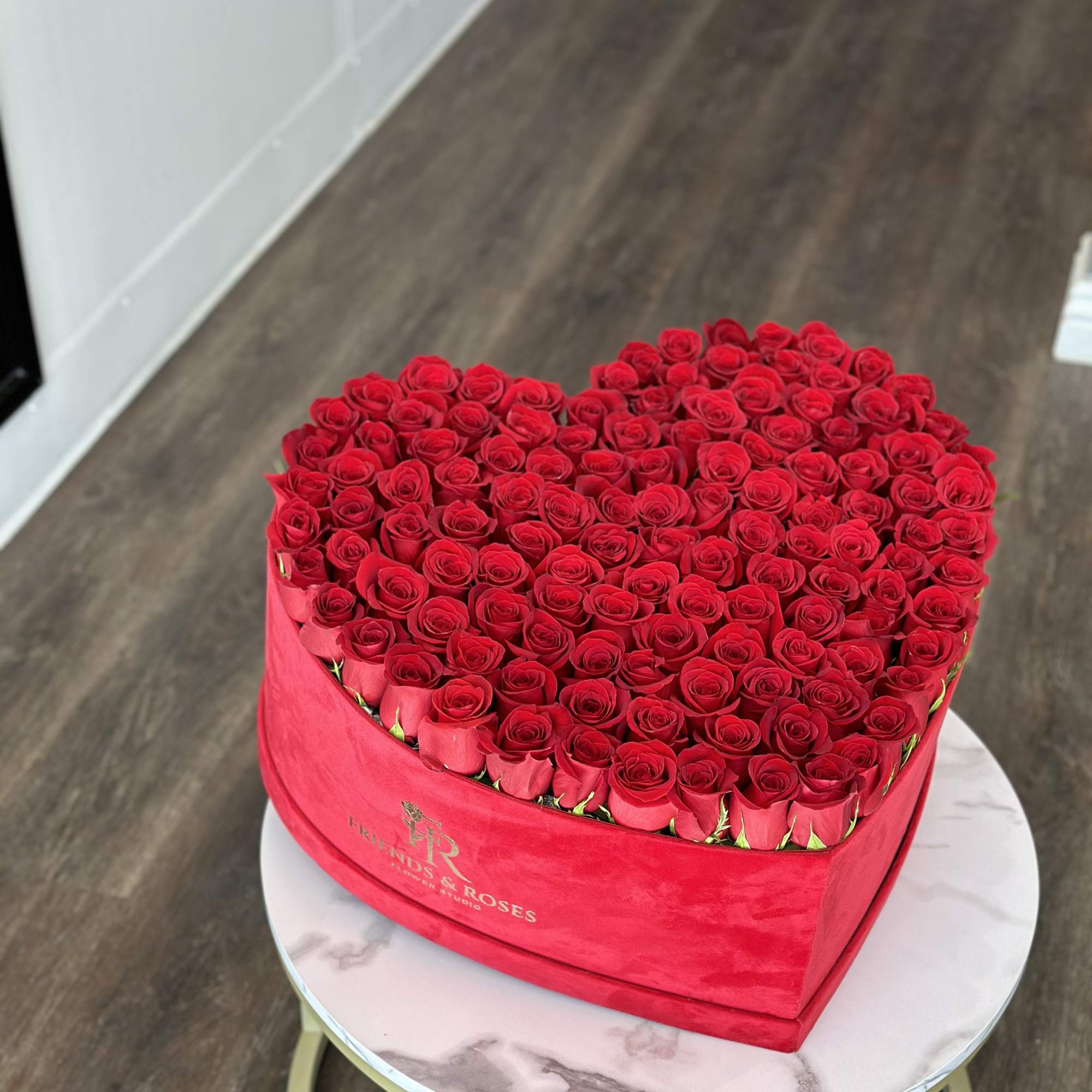 Heart-shaped box filled with red roses, photo 3 of 4