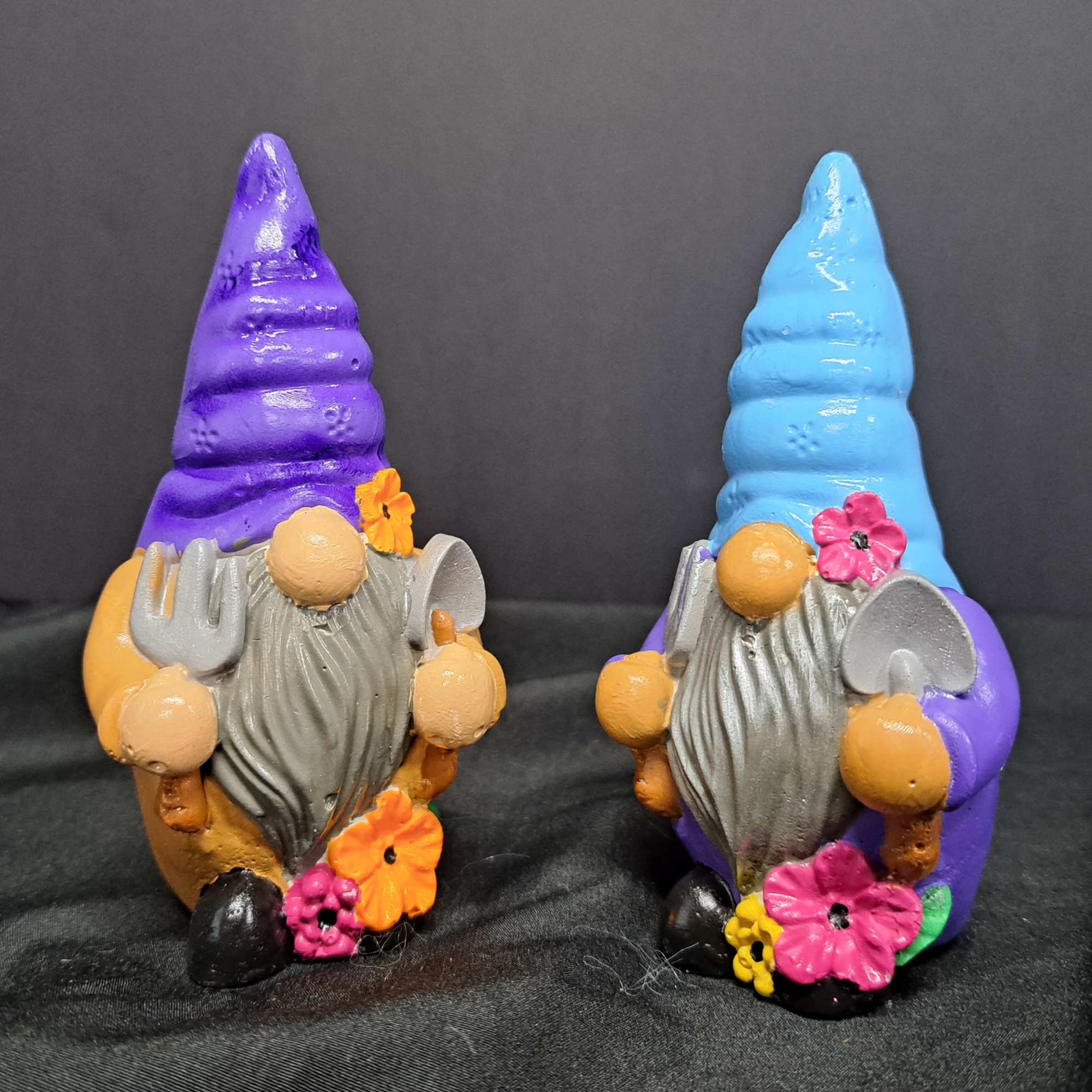 This cheerful gnome figurine bring a playful twist to a flower arrangement