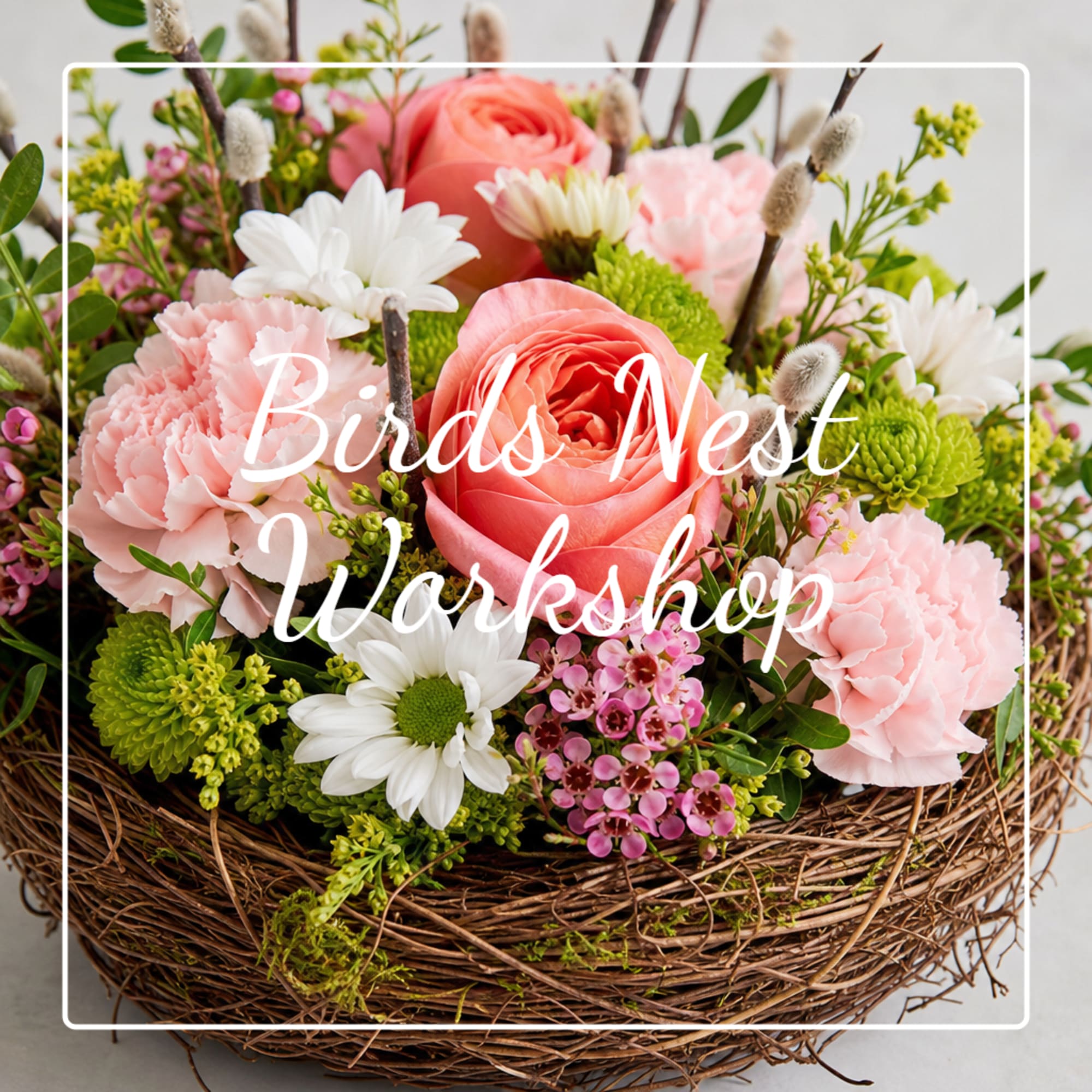 Basket arrangement of pink and white flowers with green accents