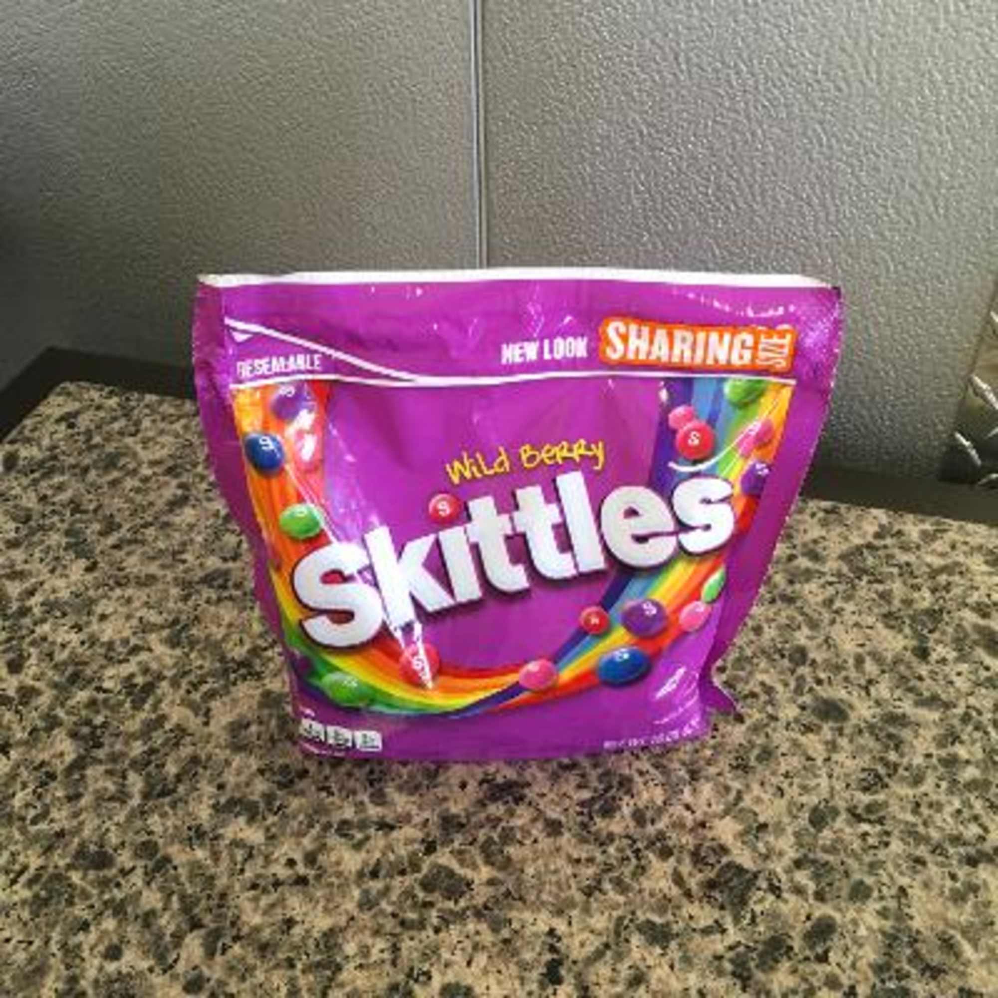 Purple Skittles candy bag on a countertop