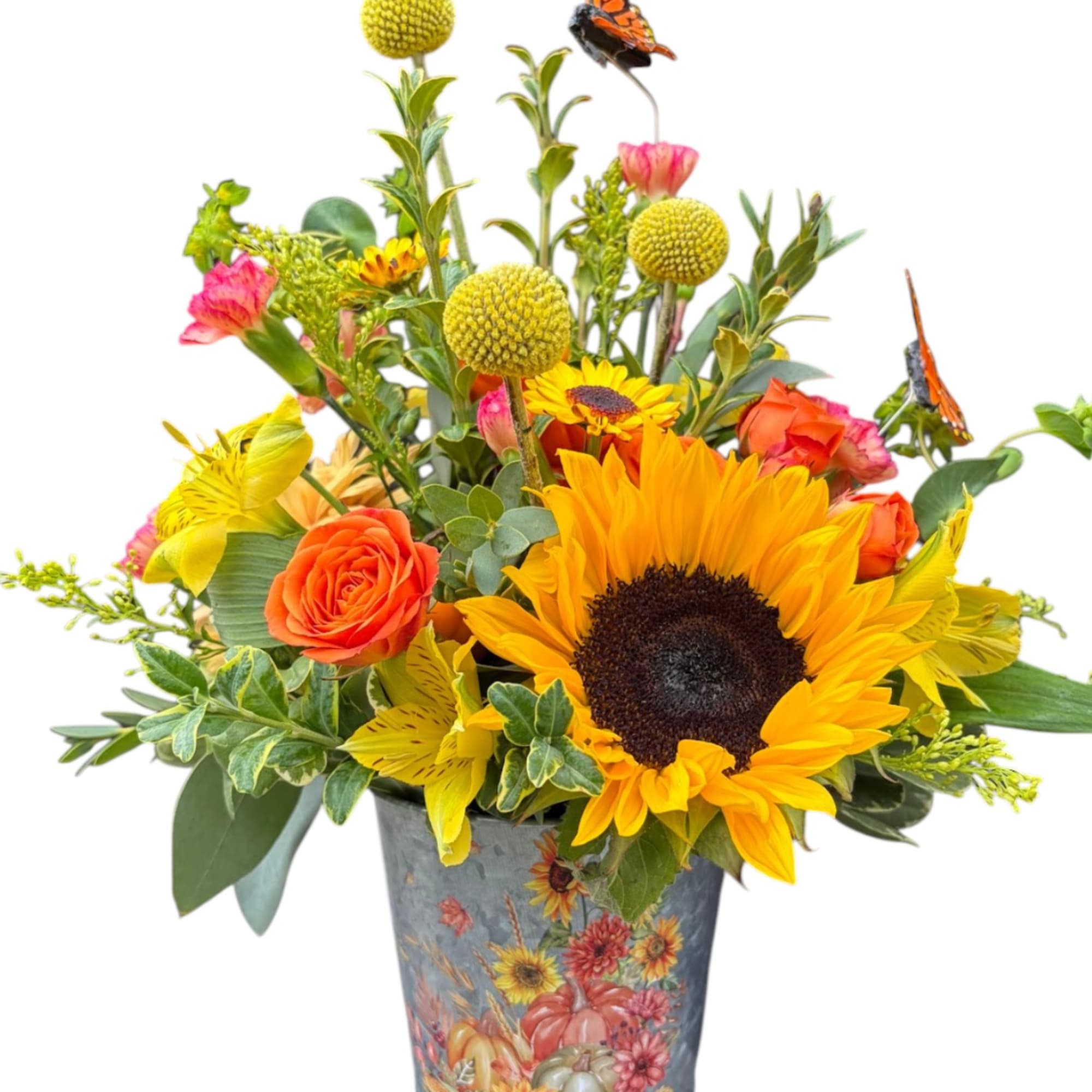 Sunflower and rose arrangement in a decorative metal vase