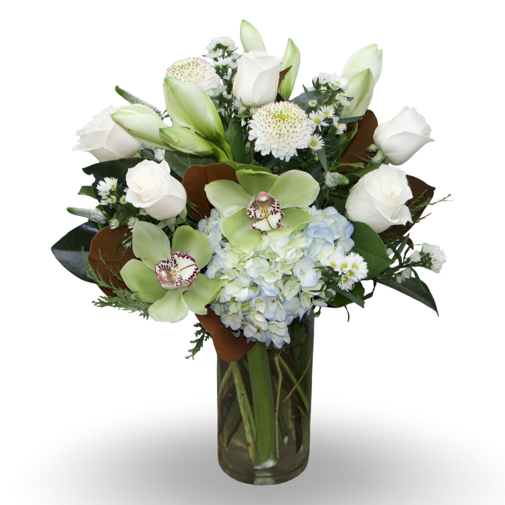 White roses and green orchids arranged with blue hydrangea in a glass vase